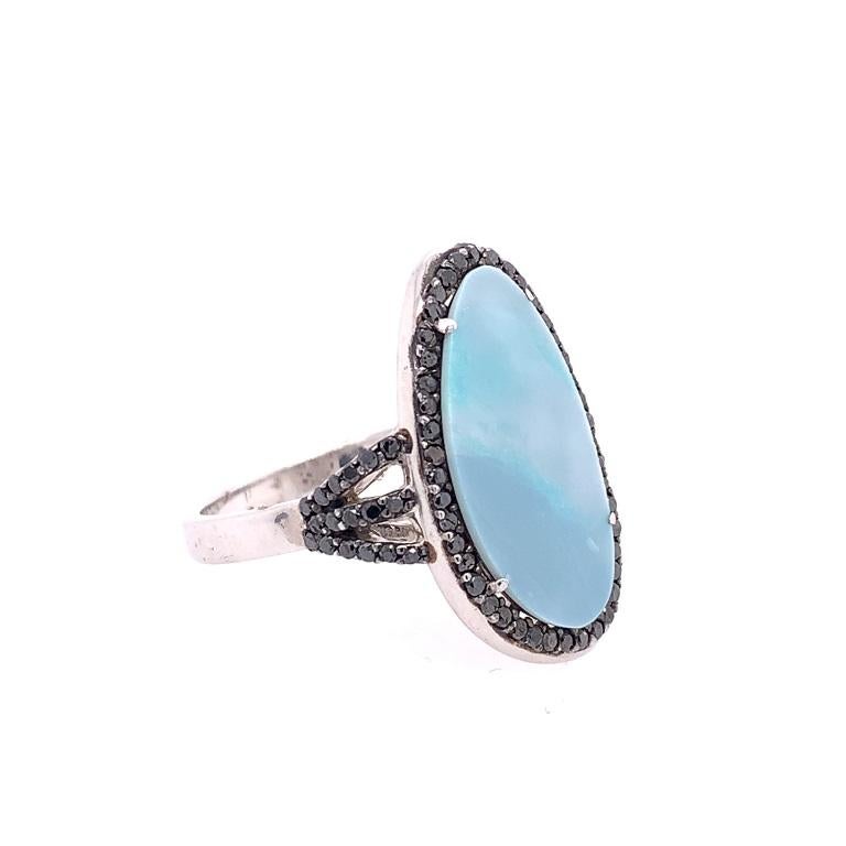 Life in Color Collection

Sky blue color Australian Opal ring with black Diamonds set in black rhodium Sterling Silver US size 7.5.

Opal Slice: 4.05ct total weight.
Black Diamonds: 0.52ct total weight.