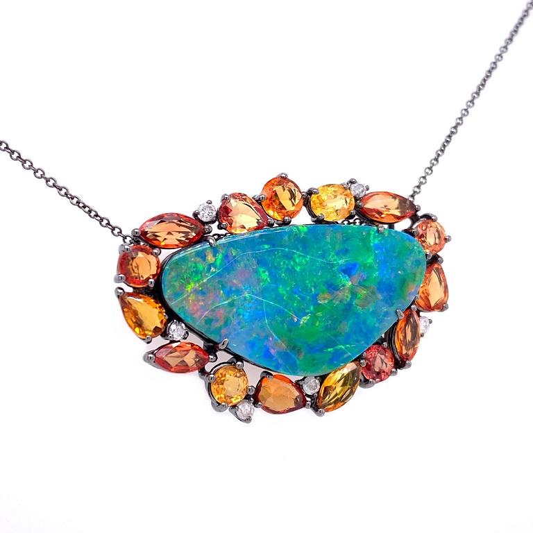 Life In Color Collection 

An enchanting Australian Opal that colorfully catches the light at every angle with multi shape orange and yellow Sapphires as well as Diamond accents. Set in solid 18K black rhodium gold with adjustable chain.