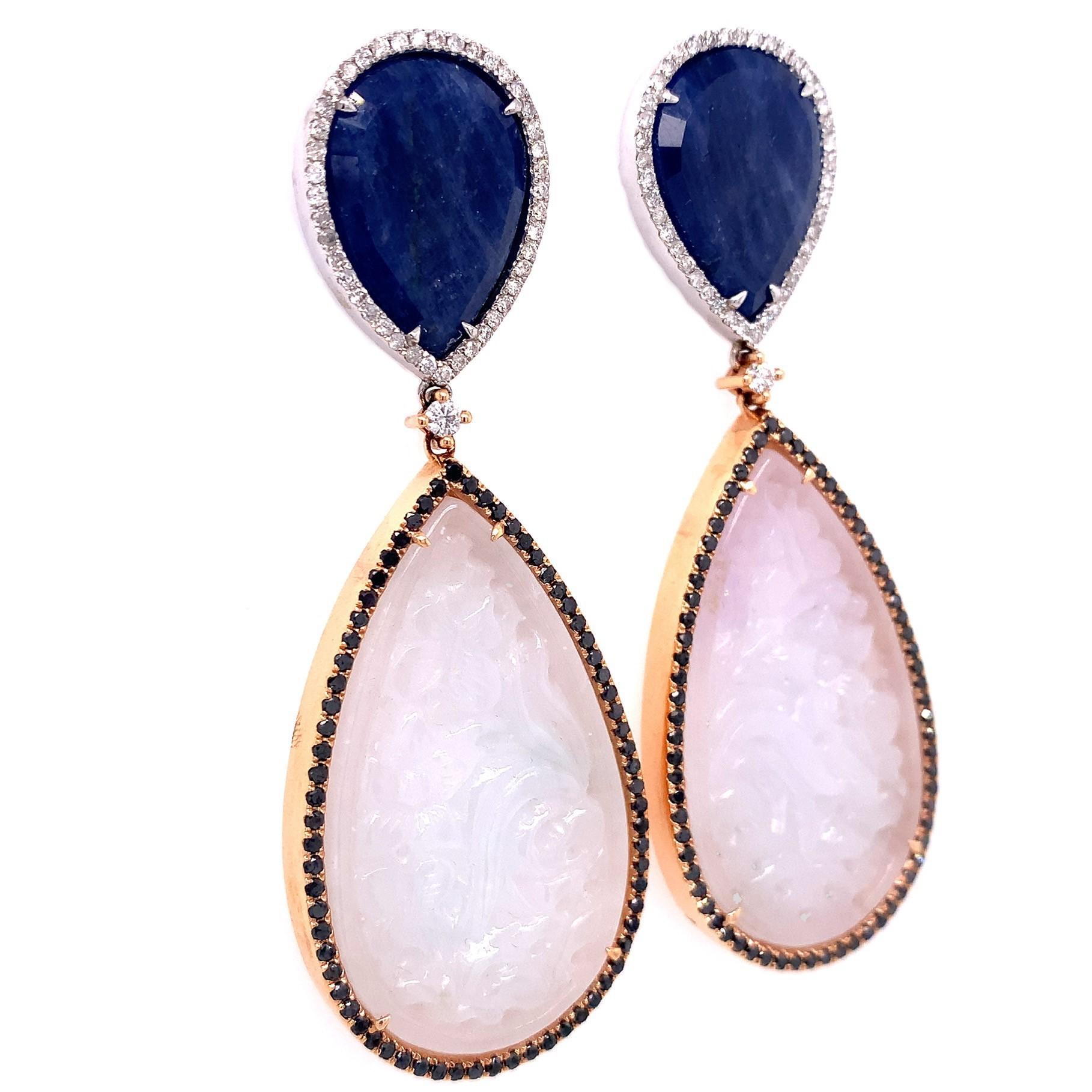 Lillipad Collection,

Intricately hand carved pure colored Jade earrings with diamonds and Blue Sapphire on top set in 18k two tone gold.

Blue Sapphire: 29.59 ct total weight.
Jade: 71.53 ct total weight.
Diamond : 0.77ct total weight.
All diamonds