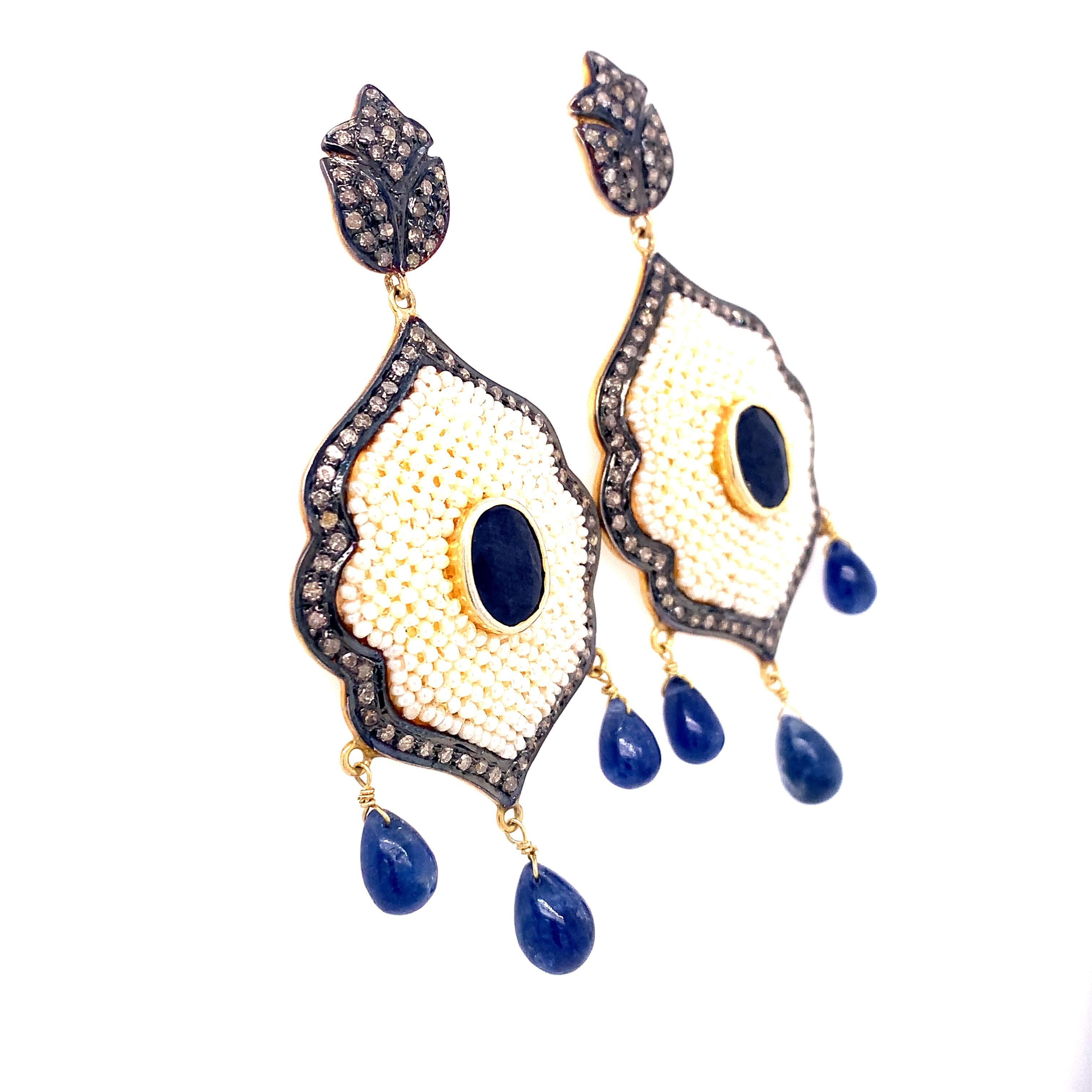 Rustic Collection 

Rustic Diamonds with Blue Sapphire and Seed Pearl chandelier earring set in sterling silver and 14K gold plating. 

Blue Sapphire : 2.47ct total weight.
Diamonds: 1.62ct total weight.