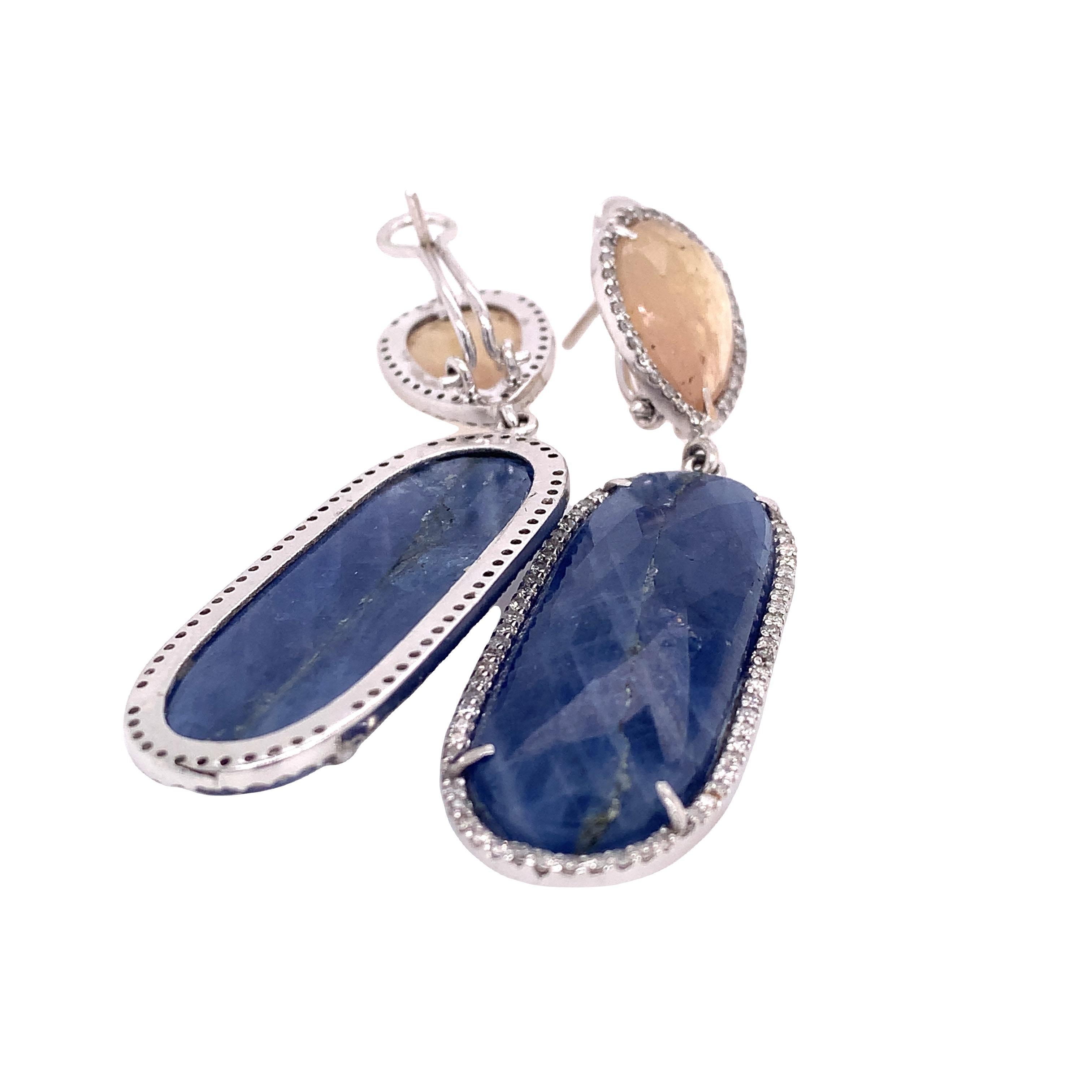 Lillipad Collection

Blue colored elongated Sapphire earrings with diamonds and pure colored Sapphire on top set in 18Kwhite gold.

Sapphire: 60.63ct total weight
Diamond: 1.37ct total weight
