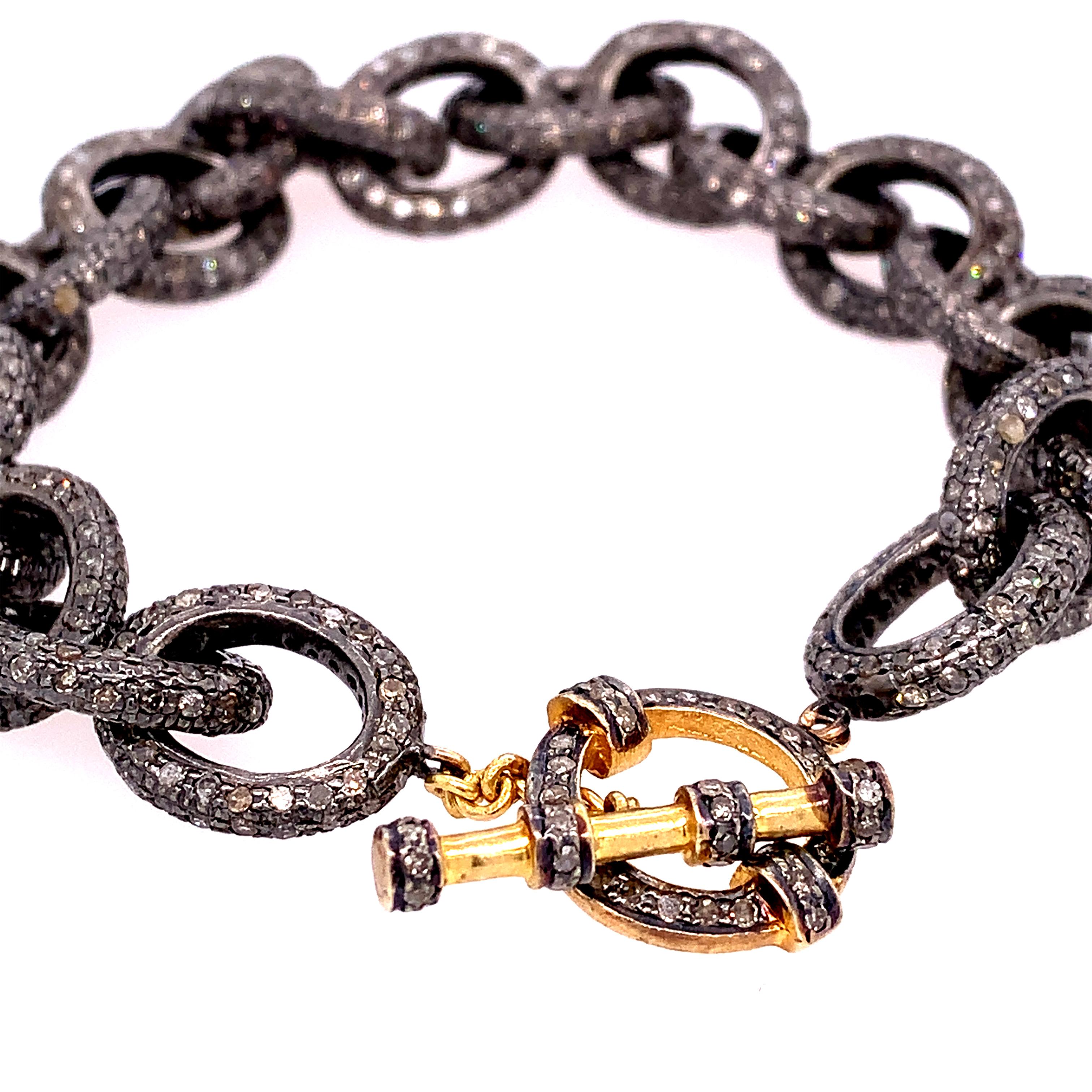 Rustic Collection

Funky rustic Diamond chain link bracelet with 14K yellow gold toggle clasp set in blackened Sterling Silver. 

Diamond: 10.91ct total weight.


