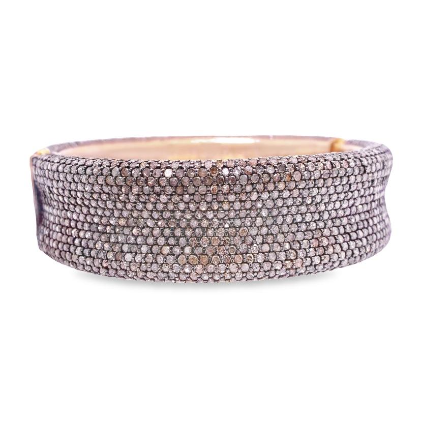 Embrace the timeless allure of our exquisite Pave Diamond Bangle, meticulously crafted to adorn your wrist with unparalleled elegance and shimmering brilliance.
The bangle's foundation is expertly crafted from high-quality sterling silver, renowned