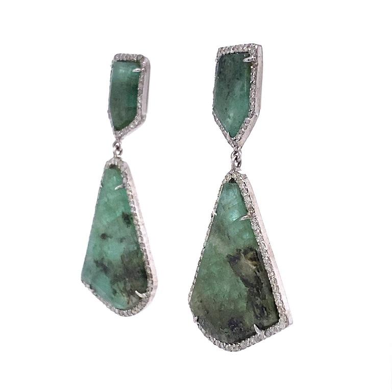 Evergreen Collection 

Natural Emerald slices wrapped in Diamonds. Set in sterling silver. 

Emeralds: 23.16ct total weight.
Diamonds: 1.33ct total weight.