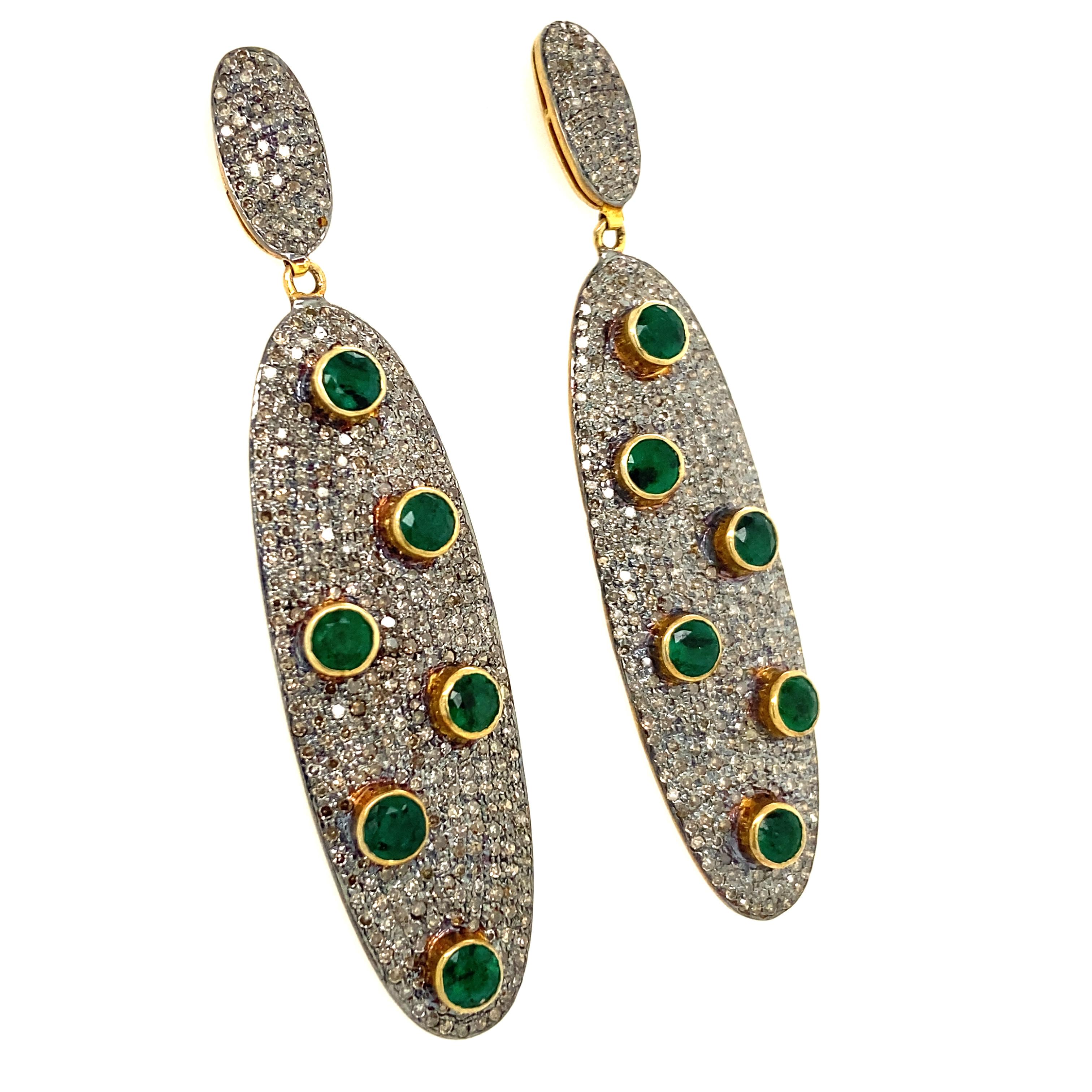 Life In Color Collection 

Eye catching Emerald drop earrings with Icy Diamond set in blackened sterling silver and 14K gold plating.

Emerald: 12.92ct total weight.
Diamond: 3.40ct total weight. 