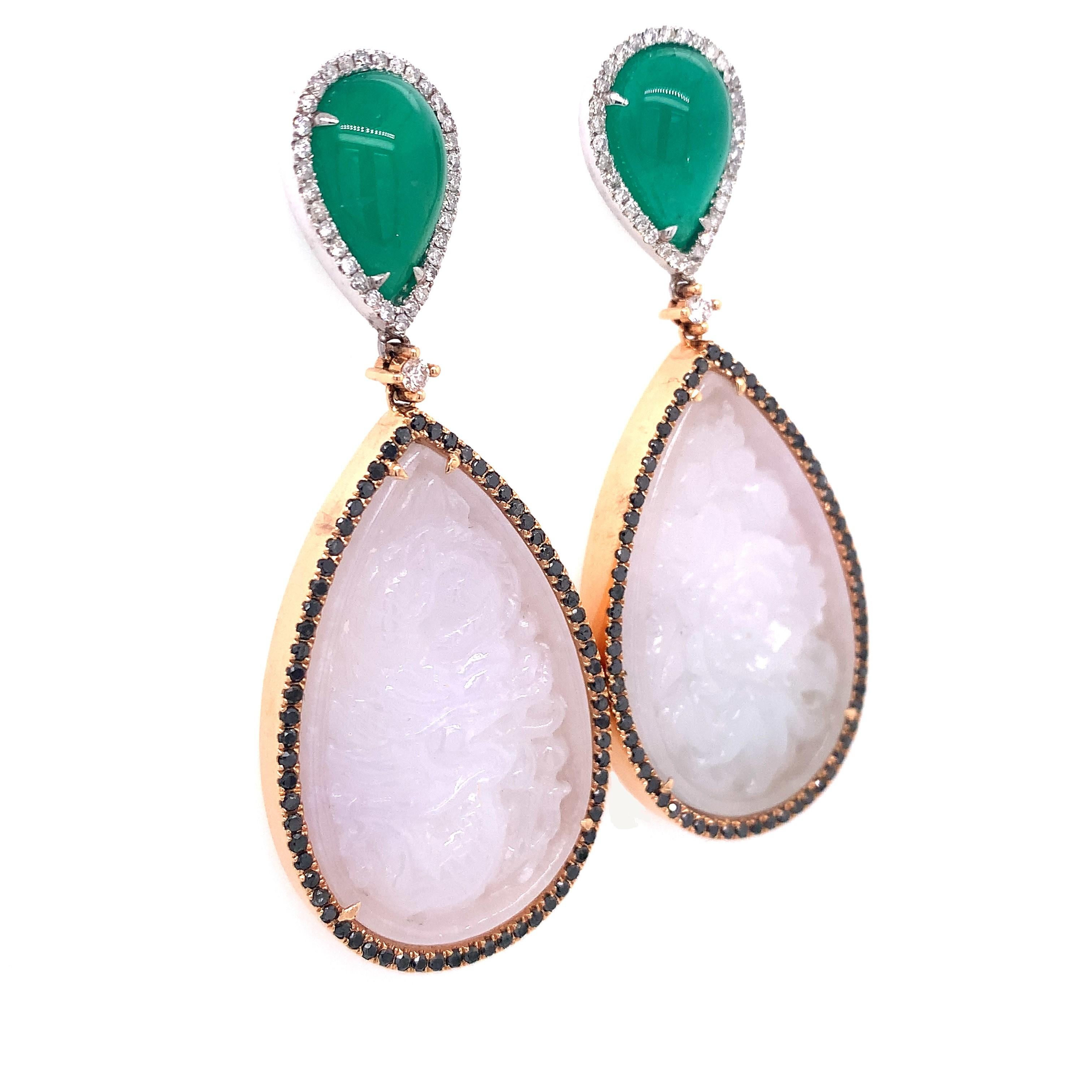 Exclusive collection,

Intricately hand carved pure colored Jade earrings with diamonds and cabochon Emerald  on top set in 18K two tone gold.

Jade: 73.04 ct total weight.
Emerald: 13.00 ct total weight.
Diamond: 0.62 ct total weight.
All diamonds