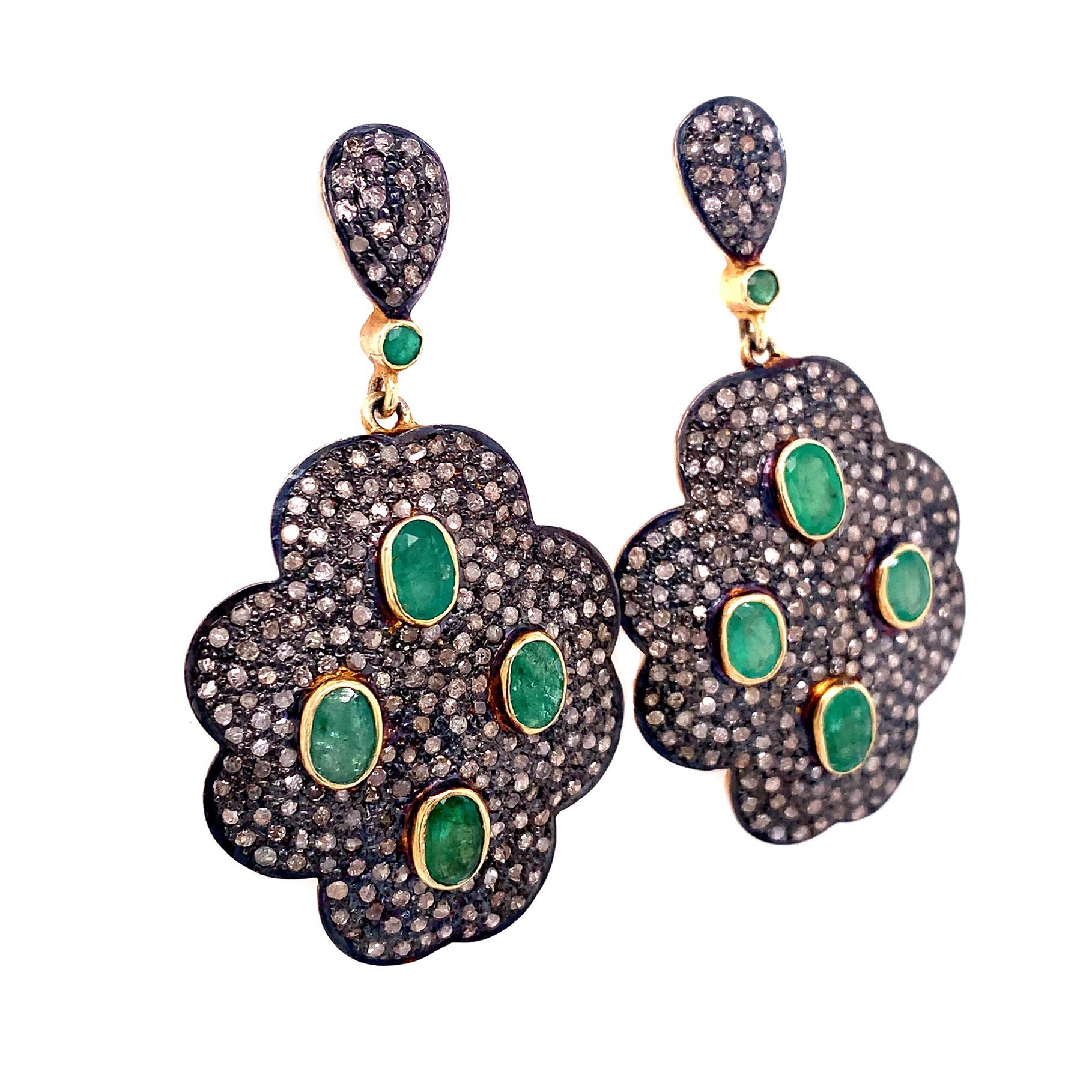 Life in color collection

Bright green oval shape Emeralds with rustic Diamonds dangle earring set in silver and 14k yellow gold plating.

Emerald : 3.65ct total weight.
Diamond : 3.76ct total weight.