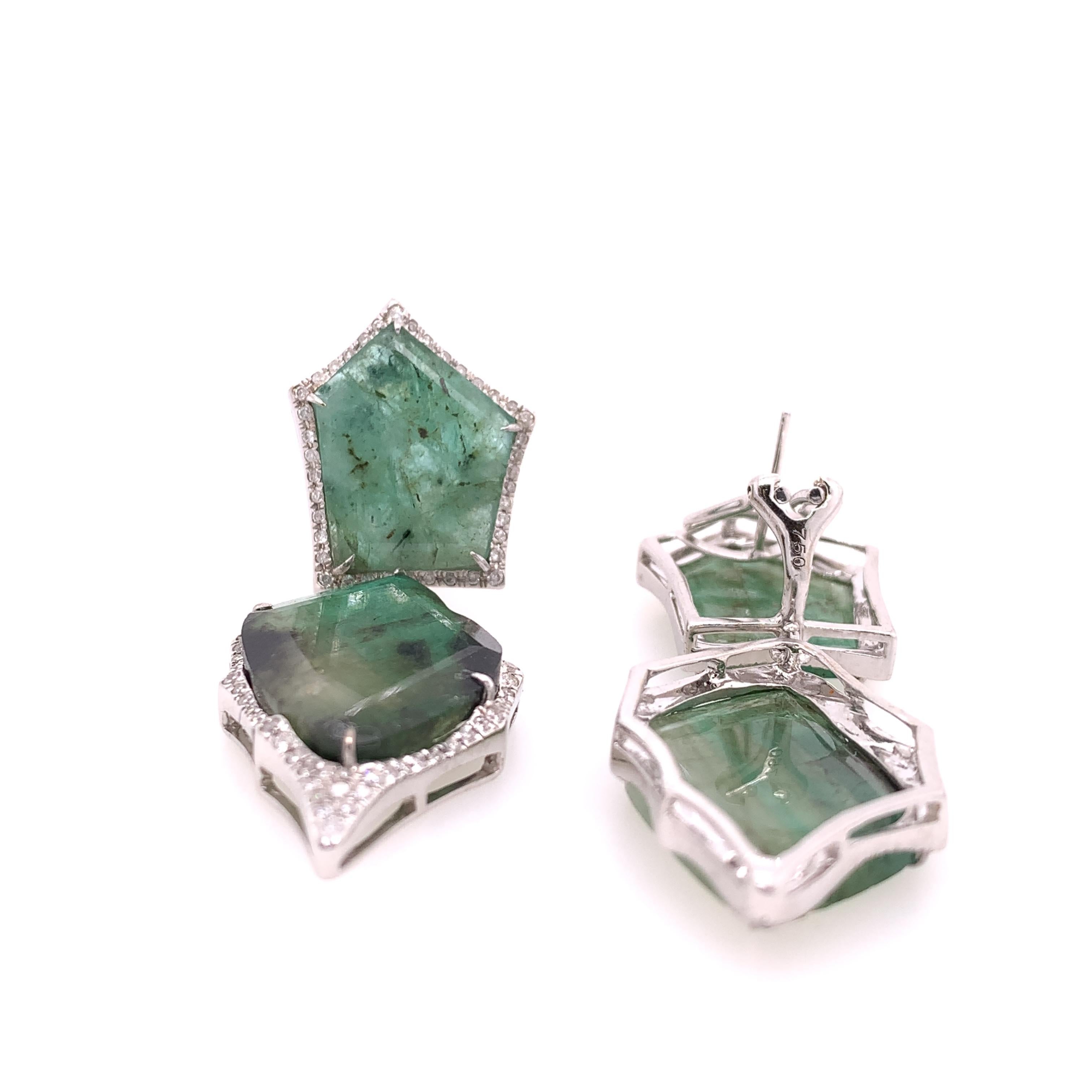 Lillipad Collection

This pair of stunning statement earrings features totaling Emerald gemstones surrounded by a gallery of diamond accents and set on 18k white gold, which makes this piece a timeless favor for any woman.

Emerald:30.67ct total