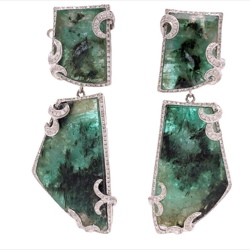 Lillipad Collection

This pair of stunning statement earrings features Emerald gemstone surrounded by a gallery of diamond accents and set on 18k white gold, which makes this piece a timeless favor for any woman.

Emerald: 30.67ct total