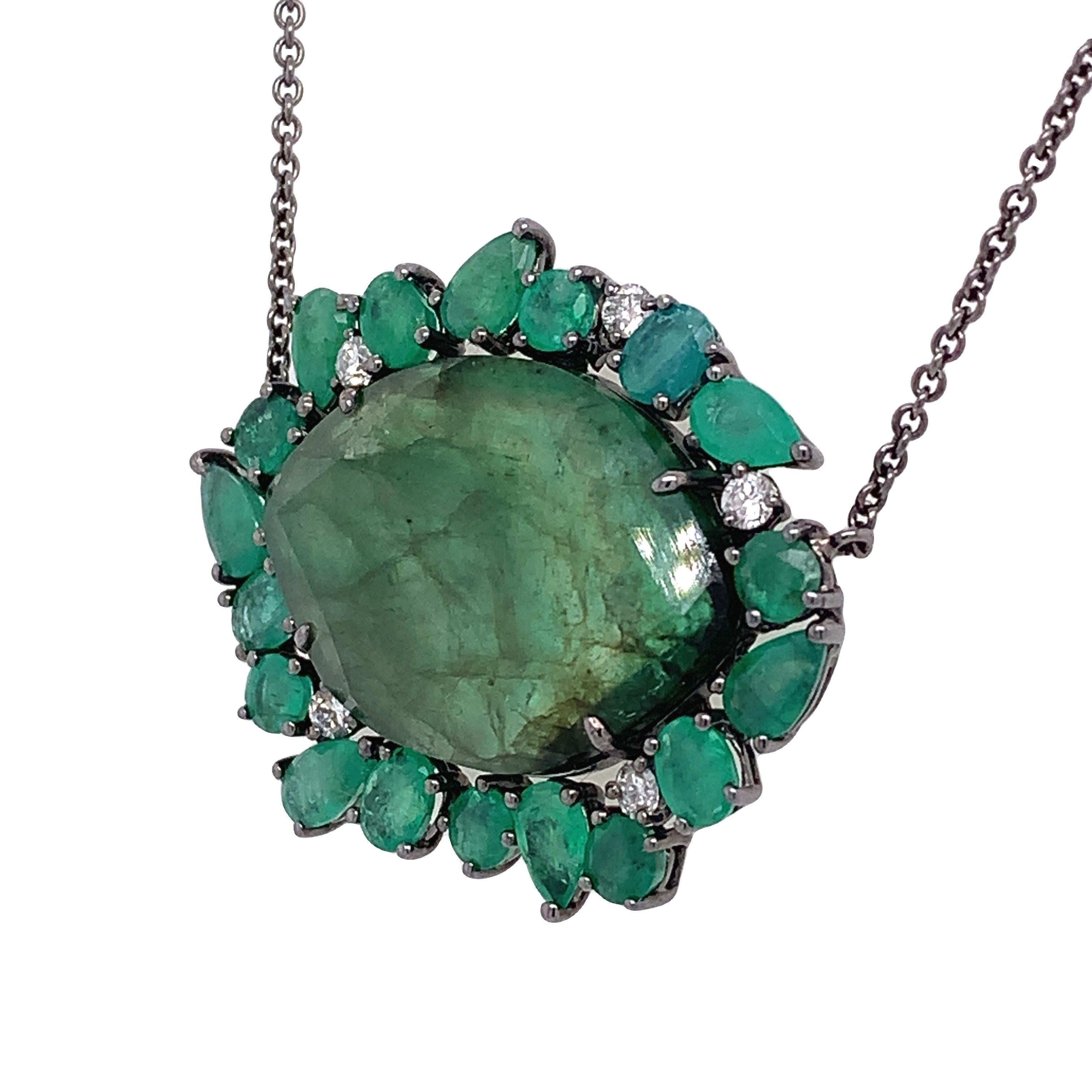 Lillipad Collection

Natural green Slice Emerald surrounded by several shape of cute Emeralds with diamonds feature as pendant necklace set in 18K rhodium black gold. The chain is 18