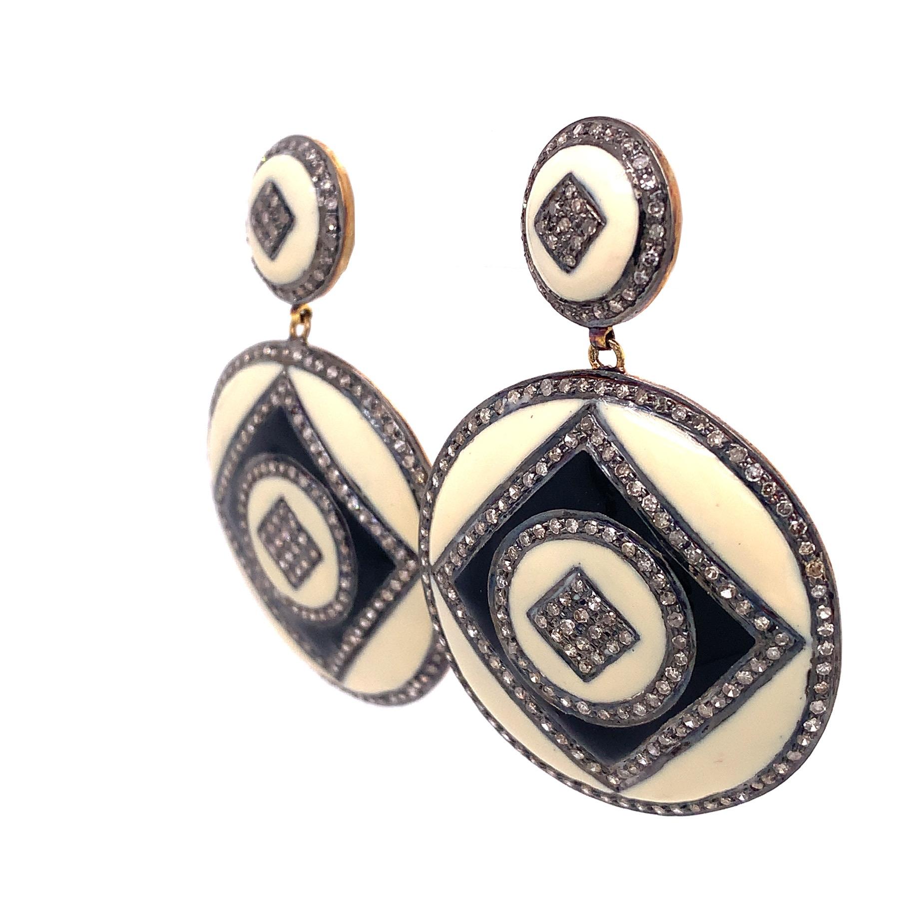Rustic Collection

Perfect contrast in these black and ivory toned Enamel and rustic Diamond disc shaped earring with circle and square motif set in sterling silver and 14 K gold plating.

Icy Diamond: 3.06 ct total weight.