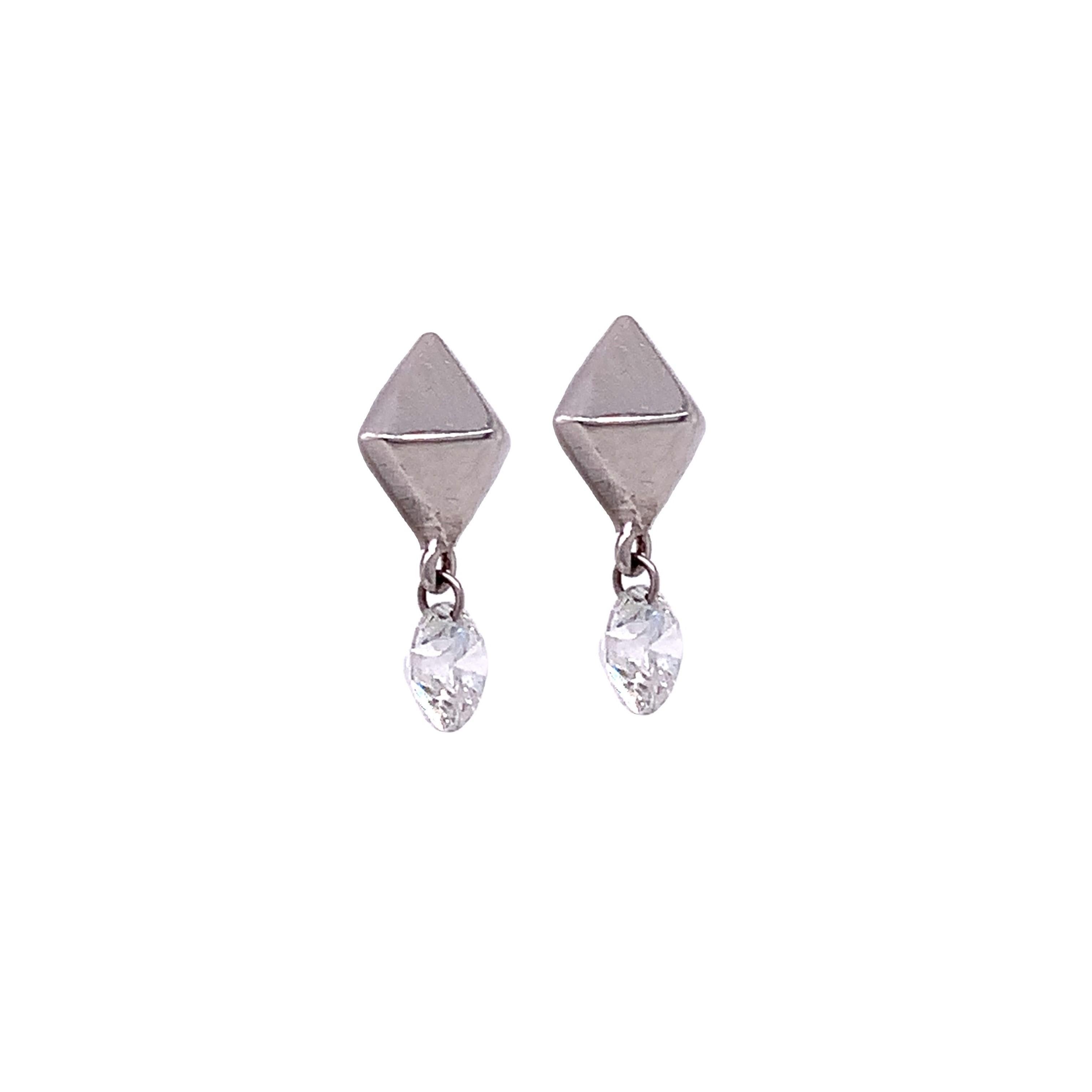 Dangling Diamond Collection,

In this collection Lucea releases their Diamonds from 18K gold to allow the maximum amount of brilliance of the Diamond by piercing them with a platinum ring letting them dangle freely.

Diamond; 0.52ct total