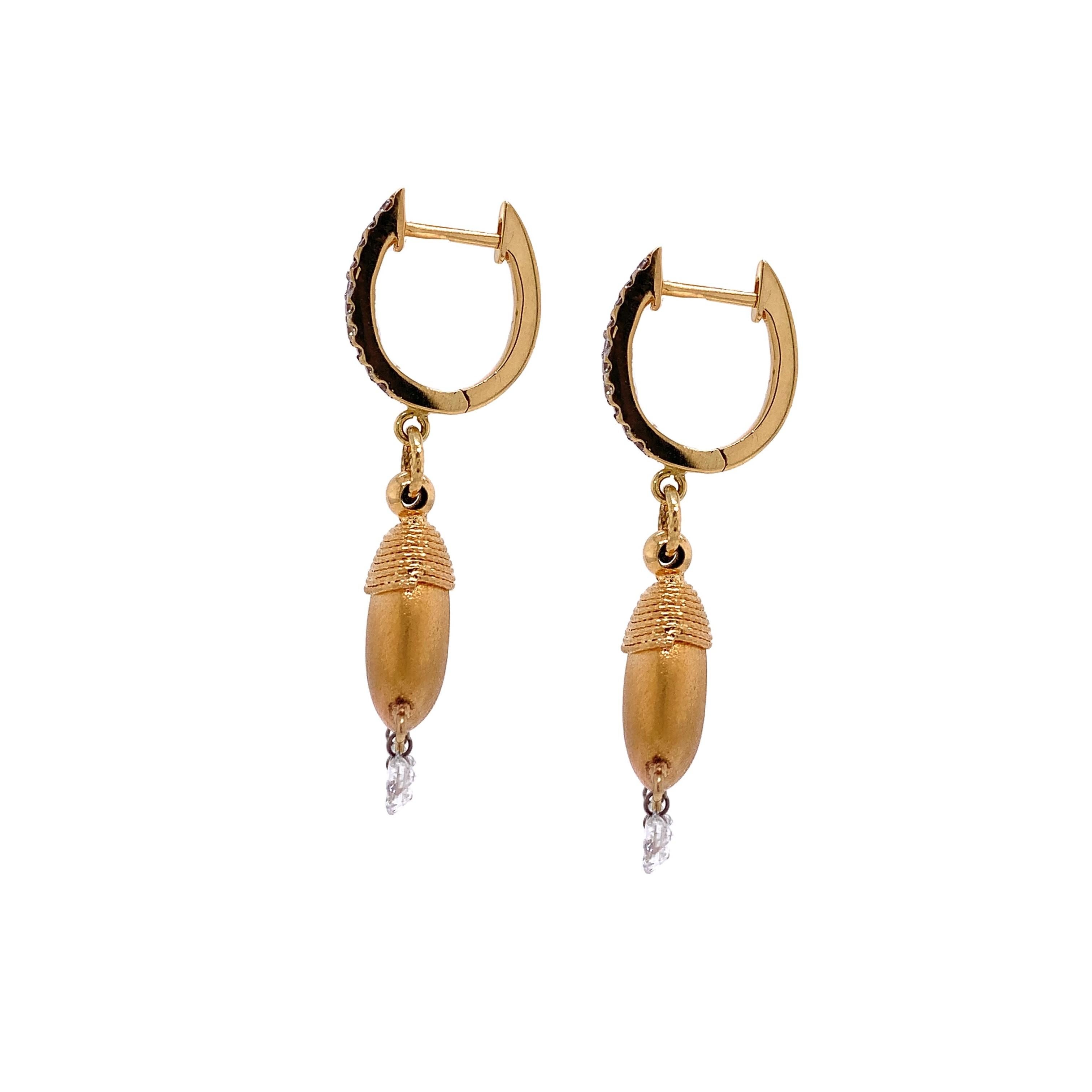 Dainty Collection

Yellow Gold drop earrings, each with 3 elegant brilliant cut round Diamonds totaling 0.71 carats dangling from gold mound with totaling 0.16 diamond huggies.