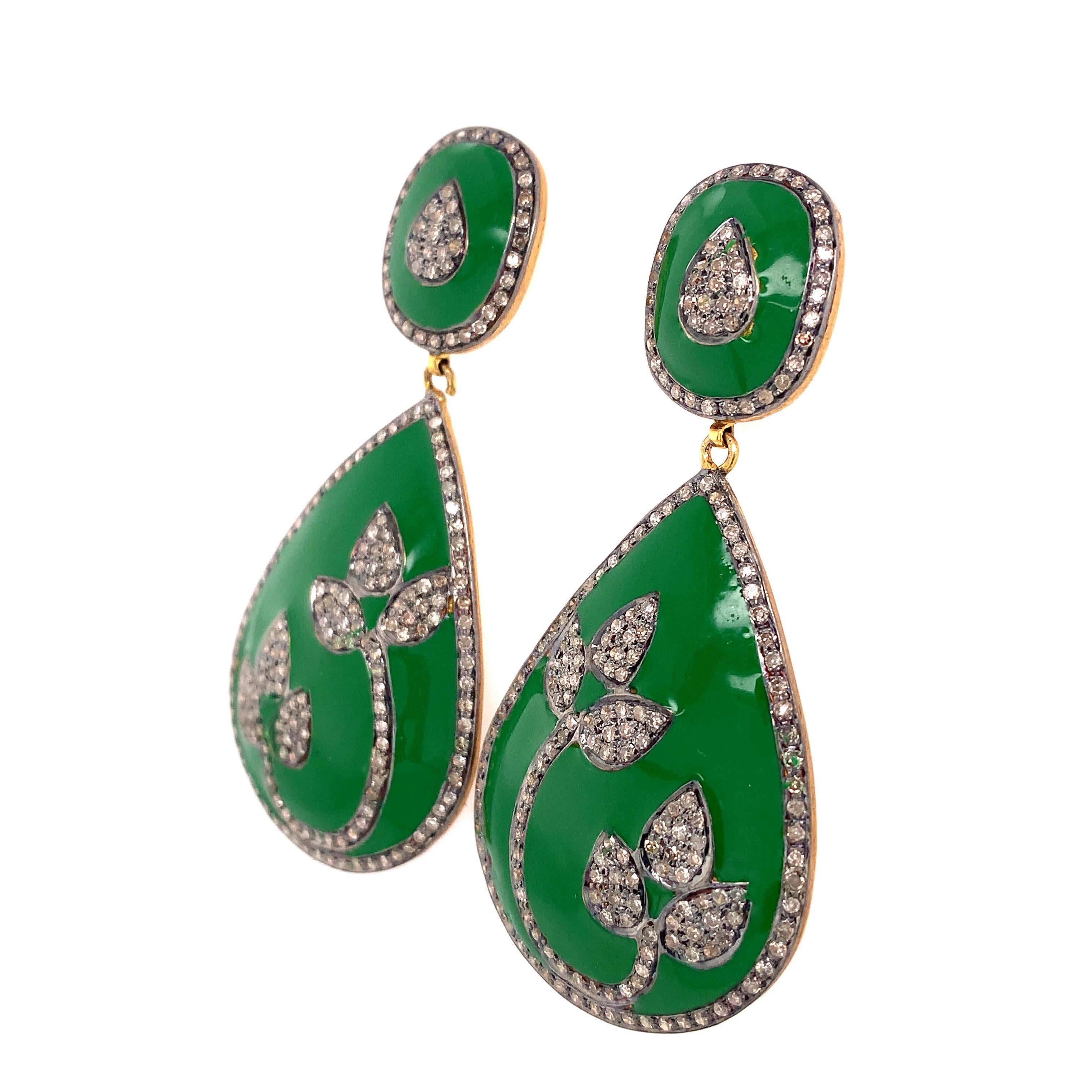 Rustic Collection

Perfect contrast in these green Enamel and rustic Diamond pear shaped earrings with leaf motif set in sterling silver and 14K gold plating.

Diamond: 2.30ct total weight.
