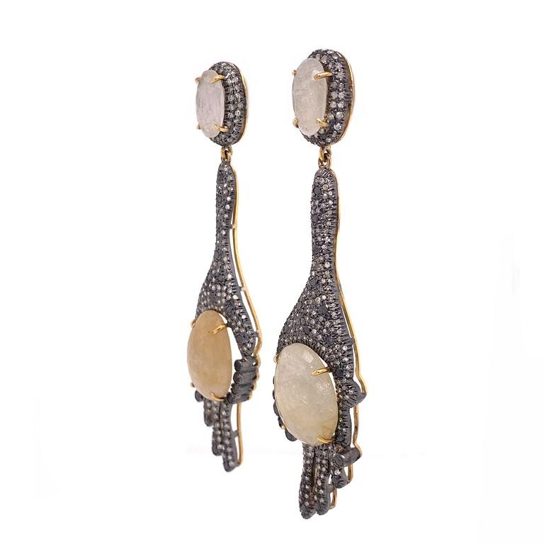 Rustic Collection 

Dramatic drop earrings featuring rose cut Moonstone and Sapphire with a mix of rustic and black Diamonds set in sterling silver. 

