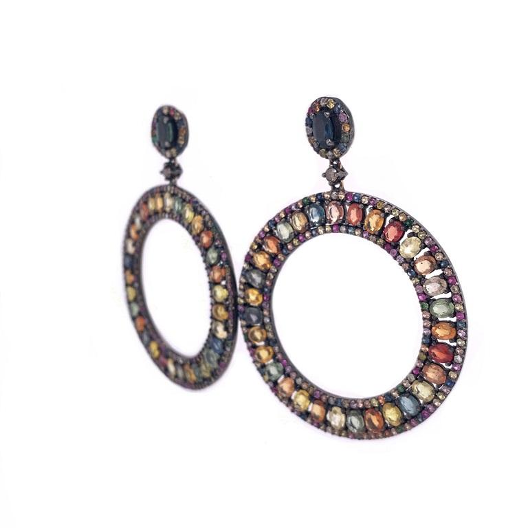 Life In Color Collection 

A fun rainbow of multi colored Sapphires and accent Diamonds in these drop circle earrings set in sterling silver. 

Multi Color Sapphire: 19.00ct total weight.
Diamonds: 0.35ct total weight.