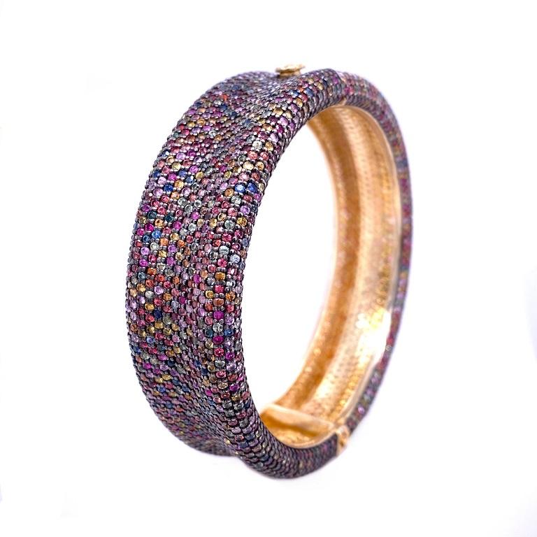 Life In Color Collection 

Bring out your colorful personality with a curved multi colored Sapphire cuff bracelet set in sterling silver and 14K gold plating. 
