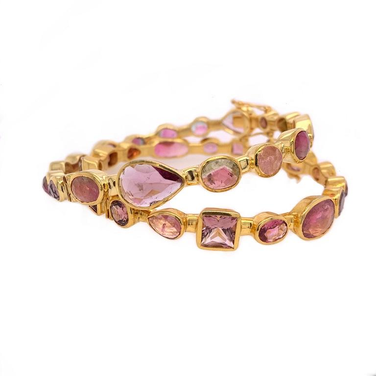Life In Color Collection 

Multi shape Tourmaline bangle set of two. One with different shades of pink and the other with a mix of pink and watermelon Tourmaline. 
Gold plated sterling silver. 