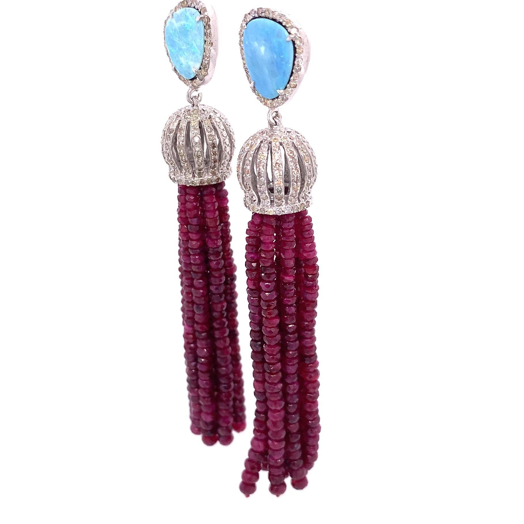 Life in Color Collection

Ruby beads featured tassel dangling from a bead cup set with Diamonds in Sterling Silver.

Ruby: 92.23 ct total weight.
Opal: 3.91 ct total weight.
Diamond: 1.51 ct total weight.
