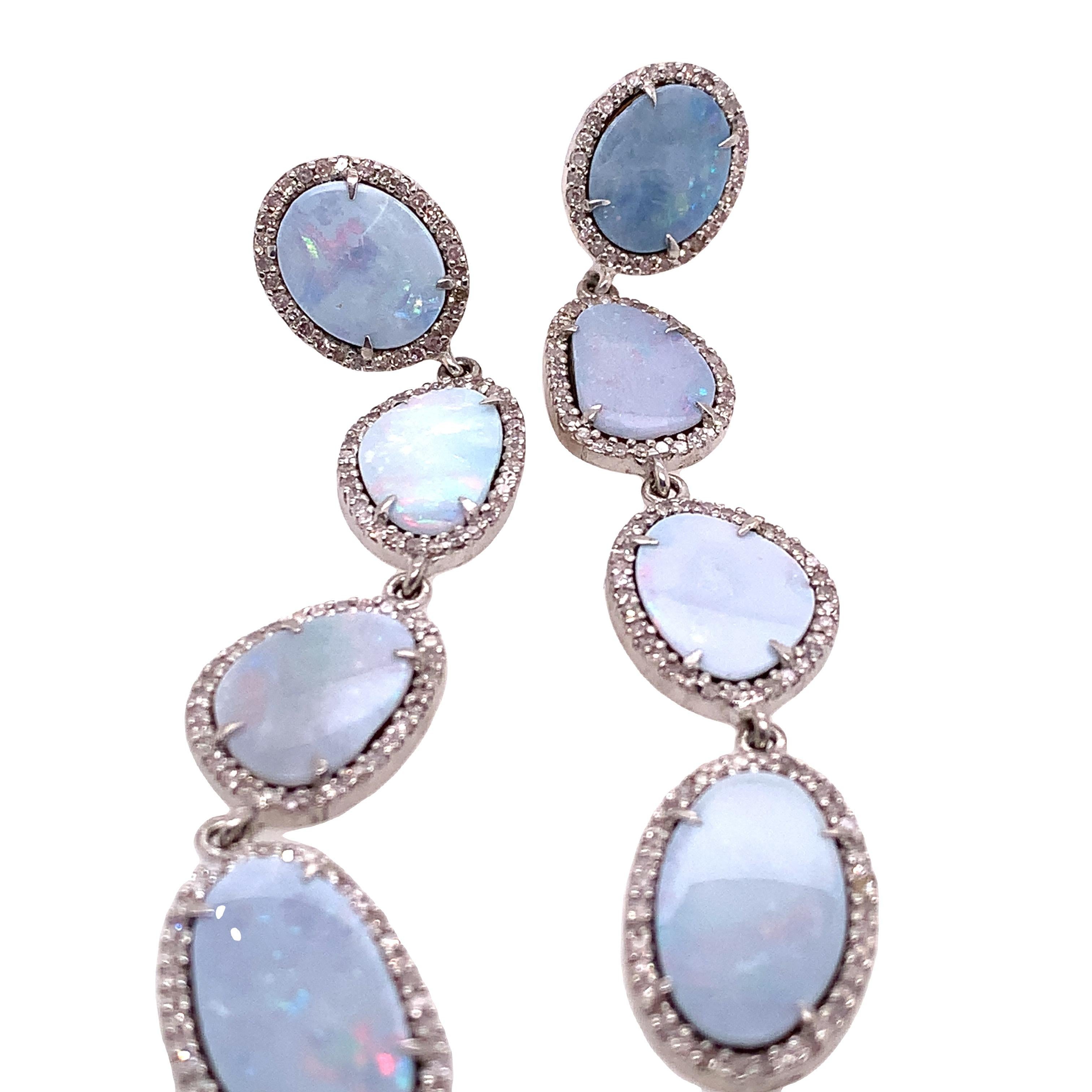 Life In Color Collection 

Sky blue color Australian Opal slice with icy Diamonds long dangle earrings set in Sterling Silver.

Opal: 32.50ct total weight
Diamond: 1.78ct total weight