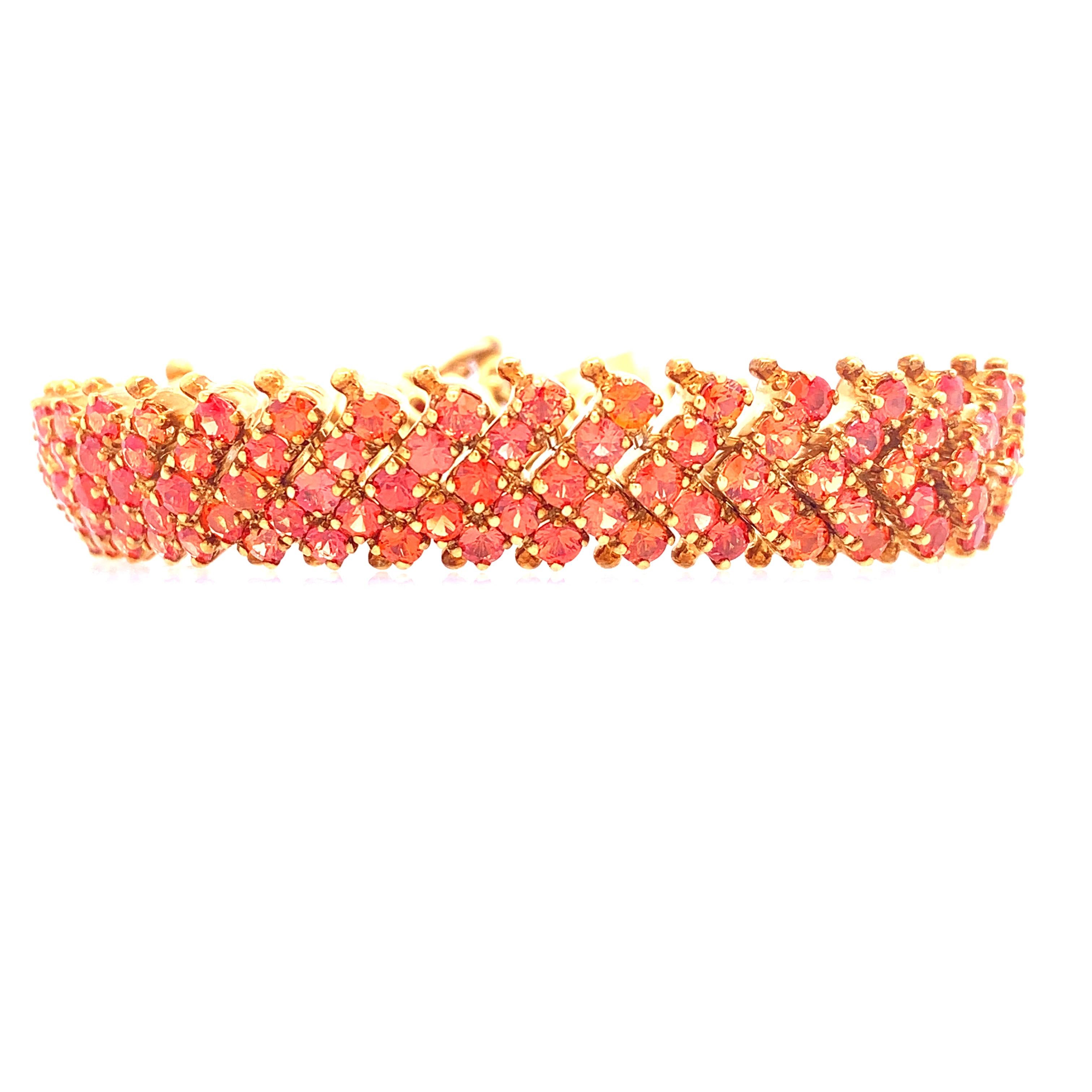 Life In Color Collection

Brilliant full cut orange sapphire bracelet set in sterling silver and plated 14K gold.

Orange Sapphire: 18.64ct total weight. 
