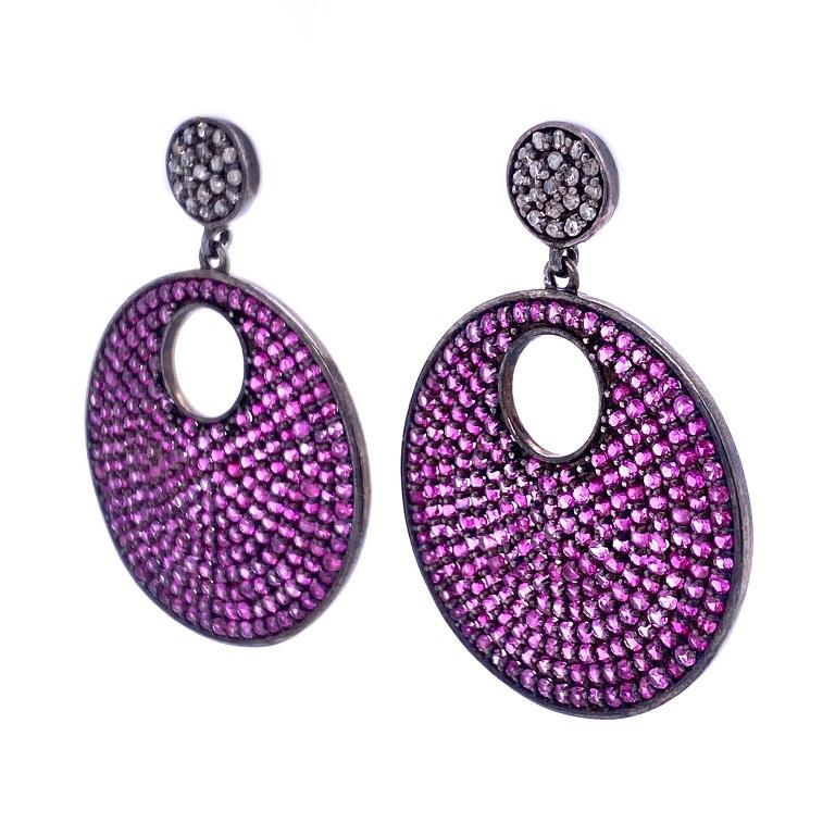 Life In Color Collection
 
Pretty in pink! Fun pink Sapphire and Diamond disc earrings set in blackened sterling silver.

Pink Sapphires: 5.26ct total weight.
Diamonds: 0.17ct total weight. 

