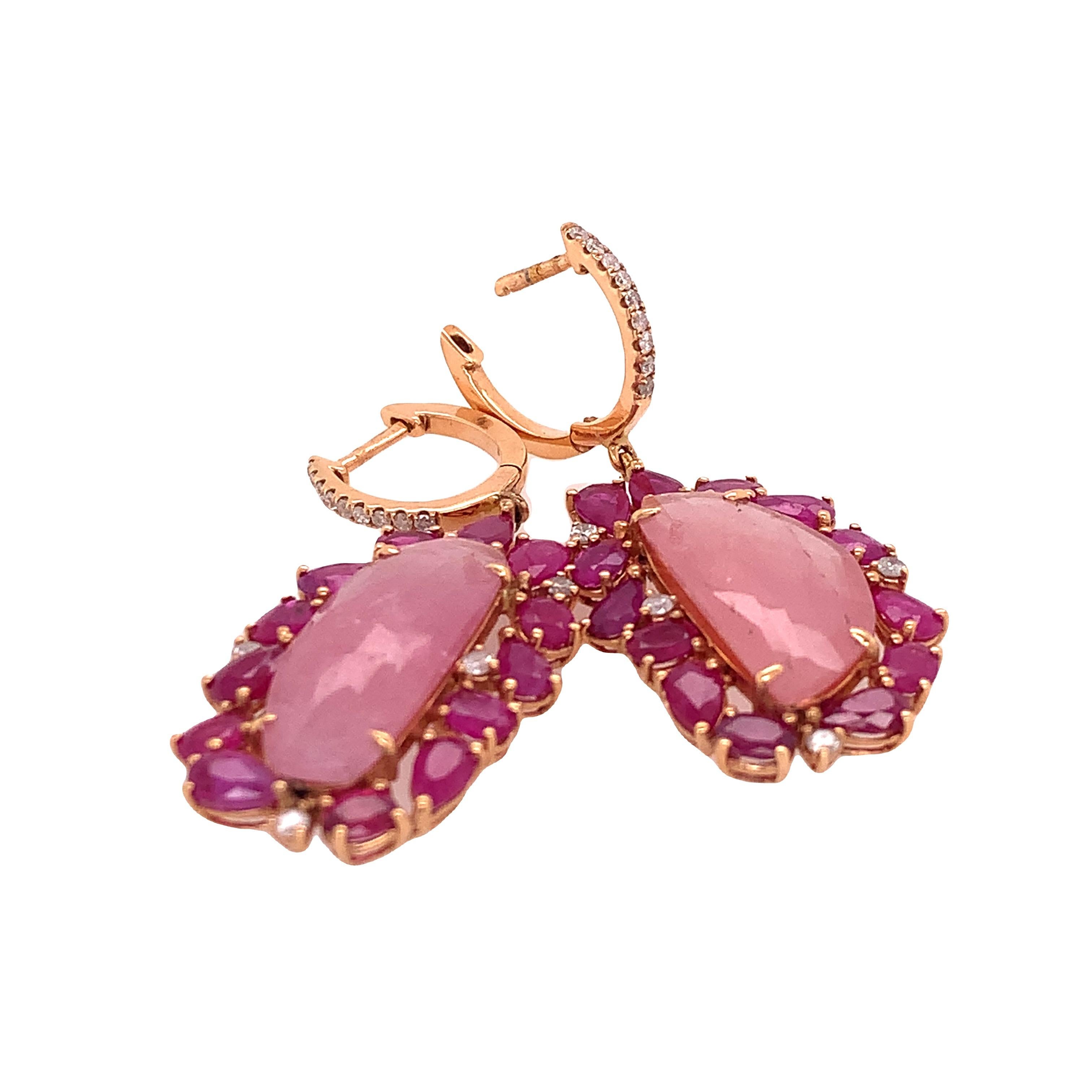 Lillipad Collection

This pair of earrings features Pink sapphire center surrounded by Ruby and Diamond accents set in 18K yellow gold. This drop earrings is light and  perfect for everyday wear.

Pink Sapphire: 18.44ct total weight.
Ruby: 6.83ct