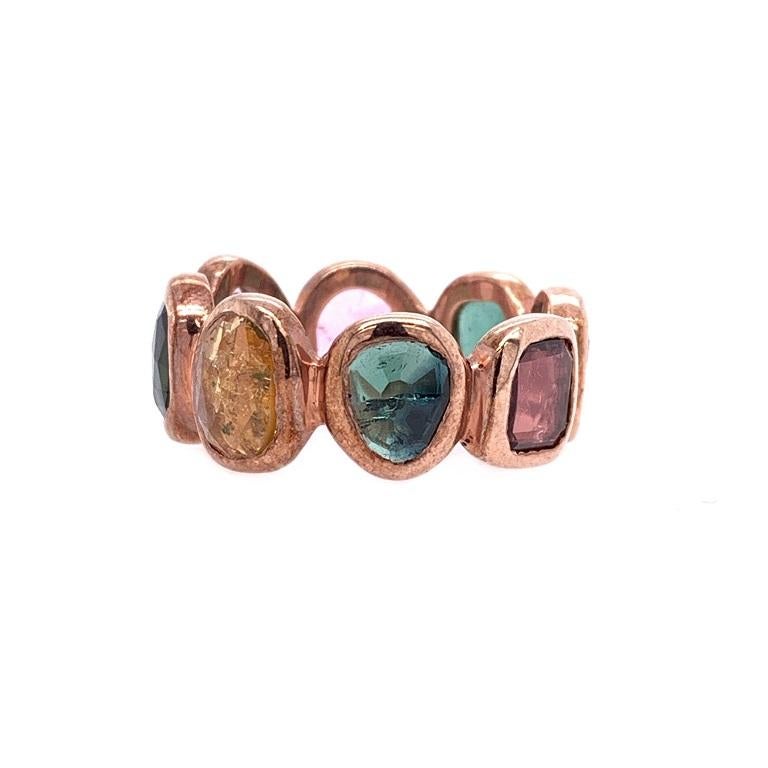 Life In Color Collection 

Multi colored rose cut Tourmaline eternity ring set in sterling silver with darkened rose gold plating. US size 8. 

Tourmaline: 4.92ct total weight. 
