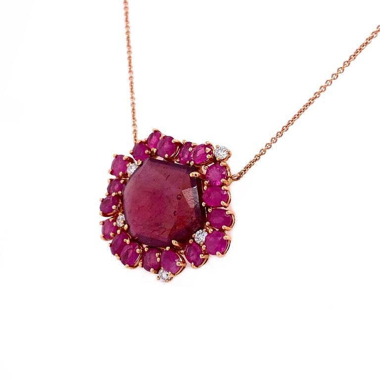 Red Rose Collection 

A rose cut Ruby slice necklace with full cut Ruby halo and Diamond accents set in solid 18K rose gold. 

Ruby Slice: 8.11ct total weight.
Full Cut Rubies: 3.53ct total weight.
Diamonds: 0.18ct total weight. 
 