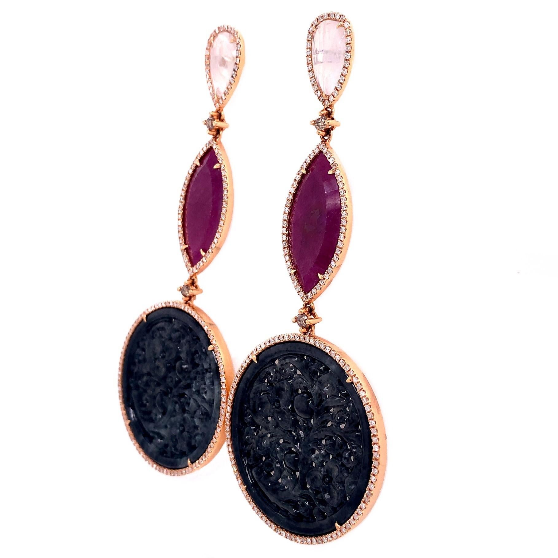 Lillipad collection,

Intricately hand carved charcoal colored Jade earring with diamonds, rubies and  moonstone on top set in 18k rose gold.

Moonstone: 3.20 ct total weight.
Ruby: 8.87 ct total weight
Jade: 40.00 ct total weight.
Diamond: 1.49 ct