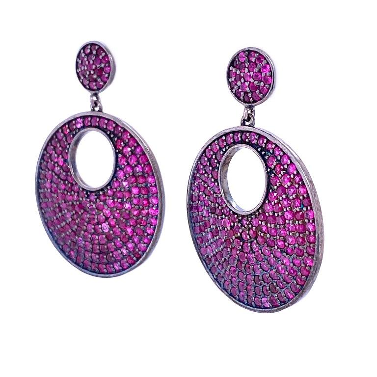 Life In Color Collection

Pop of pink Ruby disc shape dangle earrings set in darkened sterling silver. 

Ruby: 4.93ct total weight.


