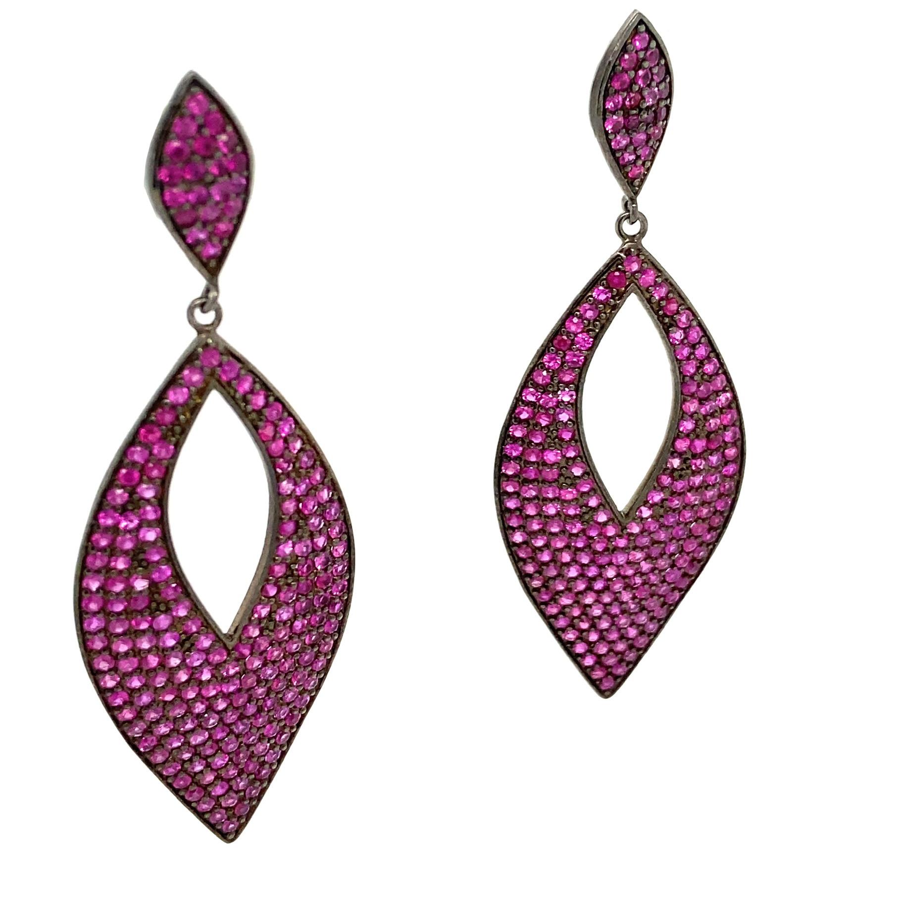 Life In Color Collection 

Eye catching Ruby drop earrings set in blackened sterling silver.

Ruby: 8.53ct total weight.