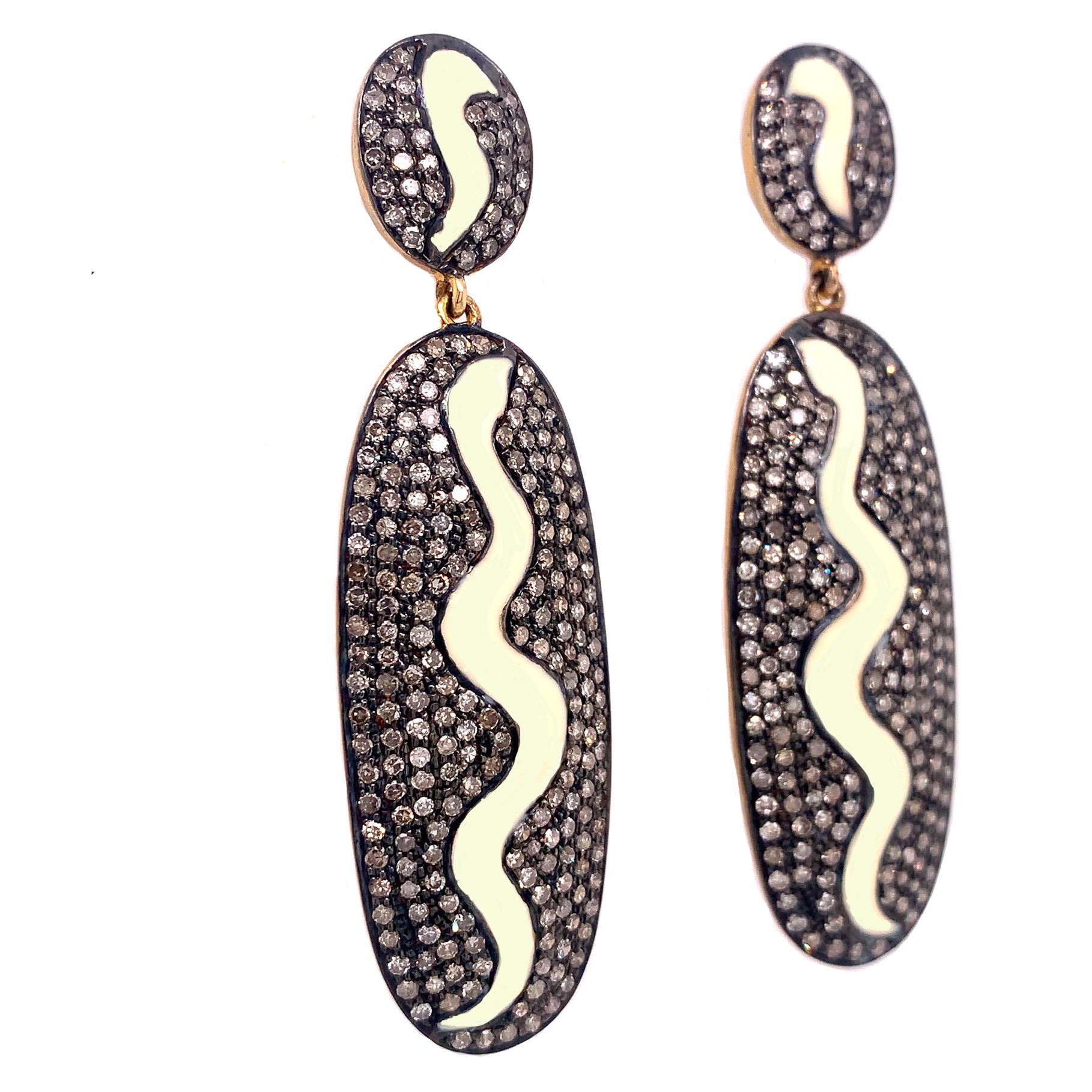 Rustic Collection

Elongated oval shape earrings with icy Diamonds and white Enamel set in Sterling Silver and gold plating.

Diamond: 3.00ct total weight.
