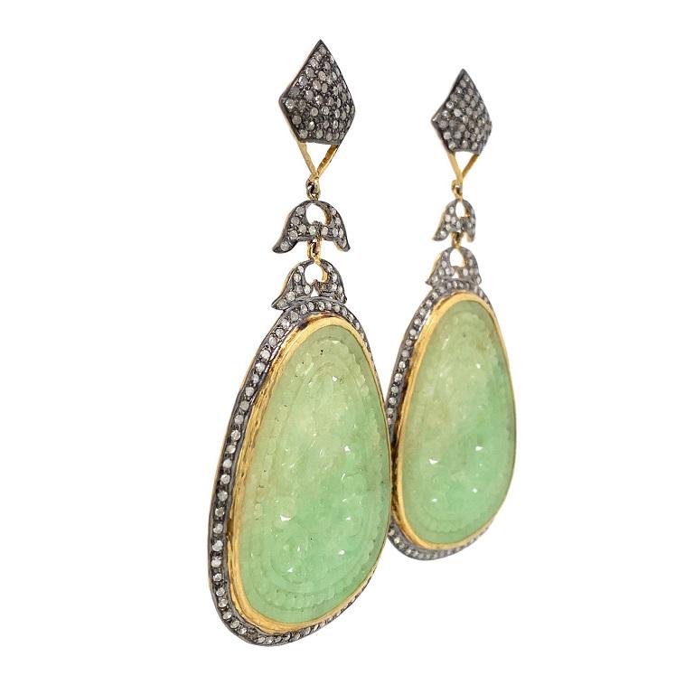 Rustic Collection 

Bold and beautiful carved green Jade with rustic Diamonds set in sterling silver and gold plating. 

