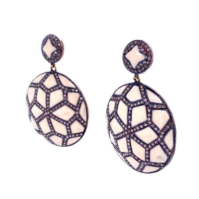 Rustic Collection

Geometric pattern ivory color enamel and rustic Diamond disc shape earrings set in sterling silver and 14K gold plating. 


