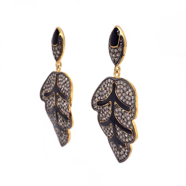 Rustic Collection

Cute yet edgy rustic Diamond and black enamel leaf drop earrings set in sterling silver and 14K gold plating. 

Diamonds: 2.54ct total weight.
