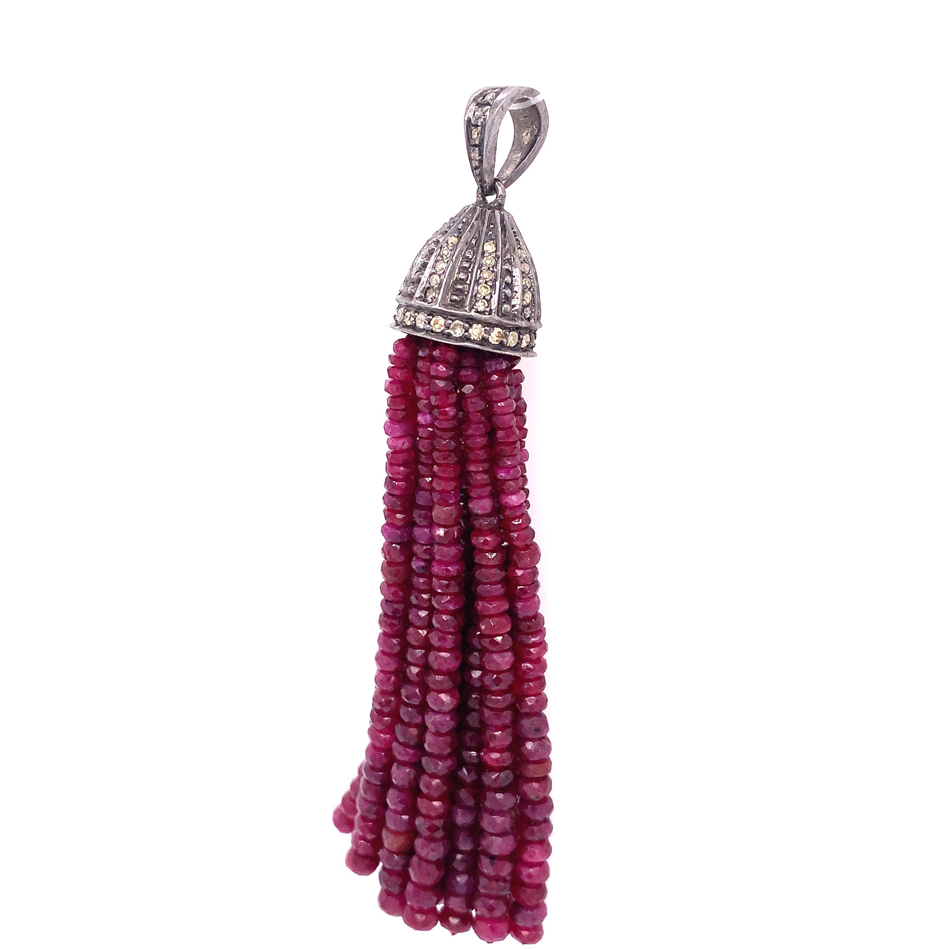 Life in Color Collection

Rustic Diamond with Ruby bead tassel pendant set in darkened sterling silver. 

Ruby: 104.75 ct total weight. 
Rustic Diamonds: 0.55 ct total weight.

