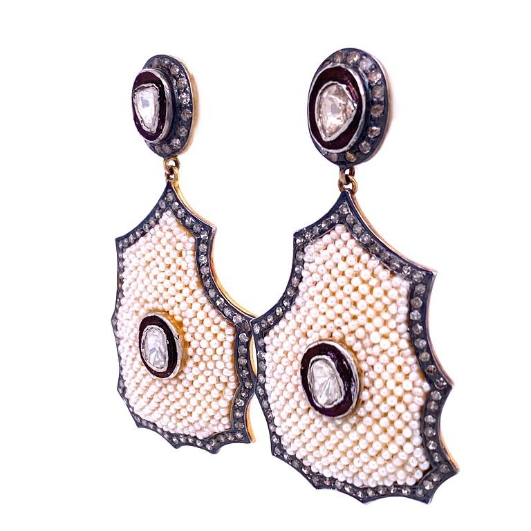 Rustic Collection

A fun combination of rustic and classic with these chandelier earrings featuring rustic Diamonds and seed Pearls set in 14K gold plated sterling silver.

Pearls: 8.90ct total weight.
Diamonds: 2.42ct total weight.
