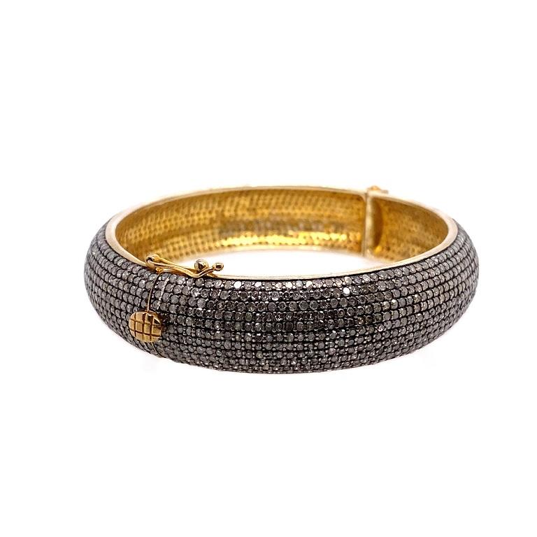 Rustic Collection 

Versatile rustic Diamond bangle bracelet set in gold plated sterling silver. Bracelet measures approximately 2.5 x 2.25 inches and 0.5 inches wide. 
