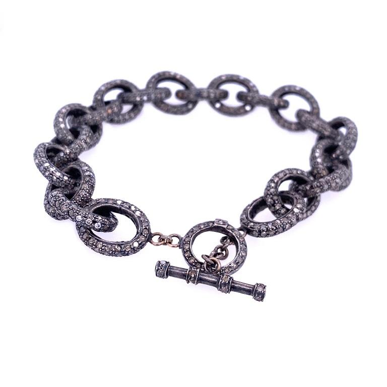 Rustic Collection

Funky rustic Diamond chain link bracelet with toggle clasp set in blackened sterling silver. 


