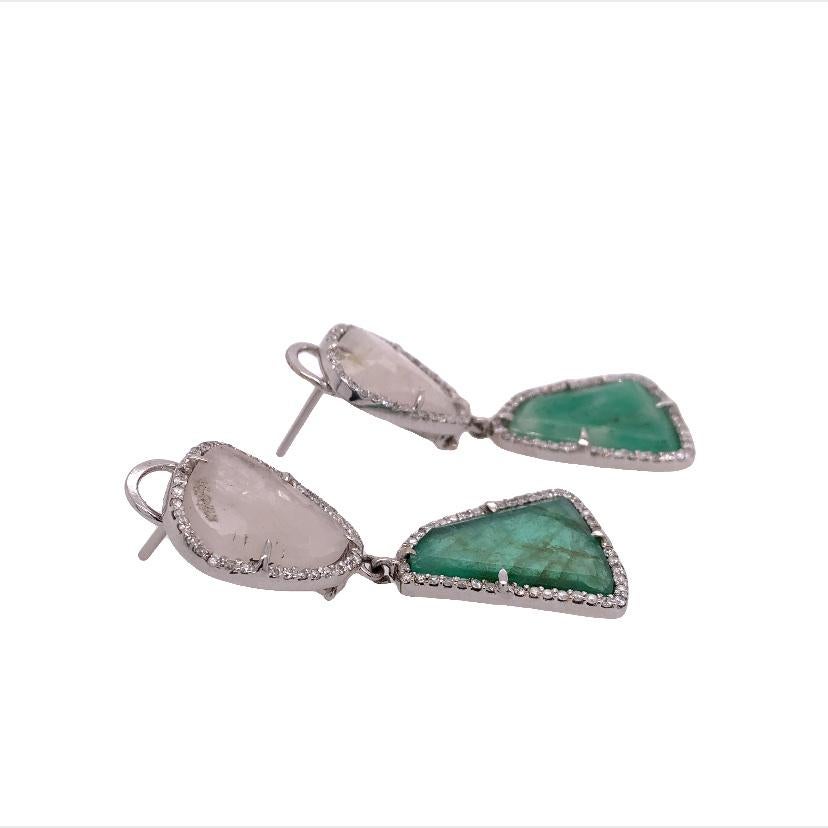 Lillipad Collection

This pair of stunning statement earrings features White Sapphire and Emerald gemstone surrounded by a gallery of diamond accents and set on 18k white gold, which makes this piece a timeless favor for any woman.
