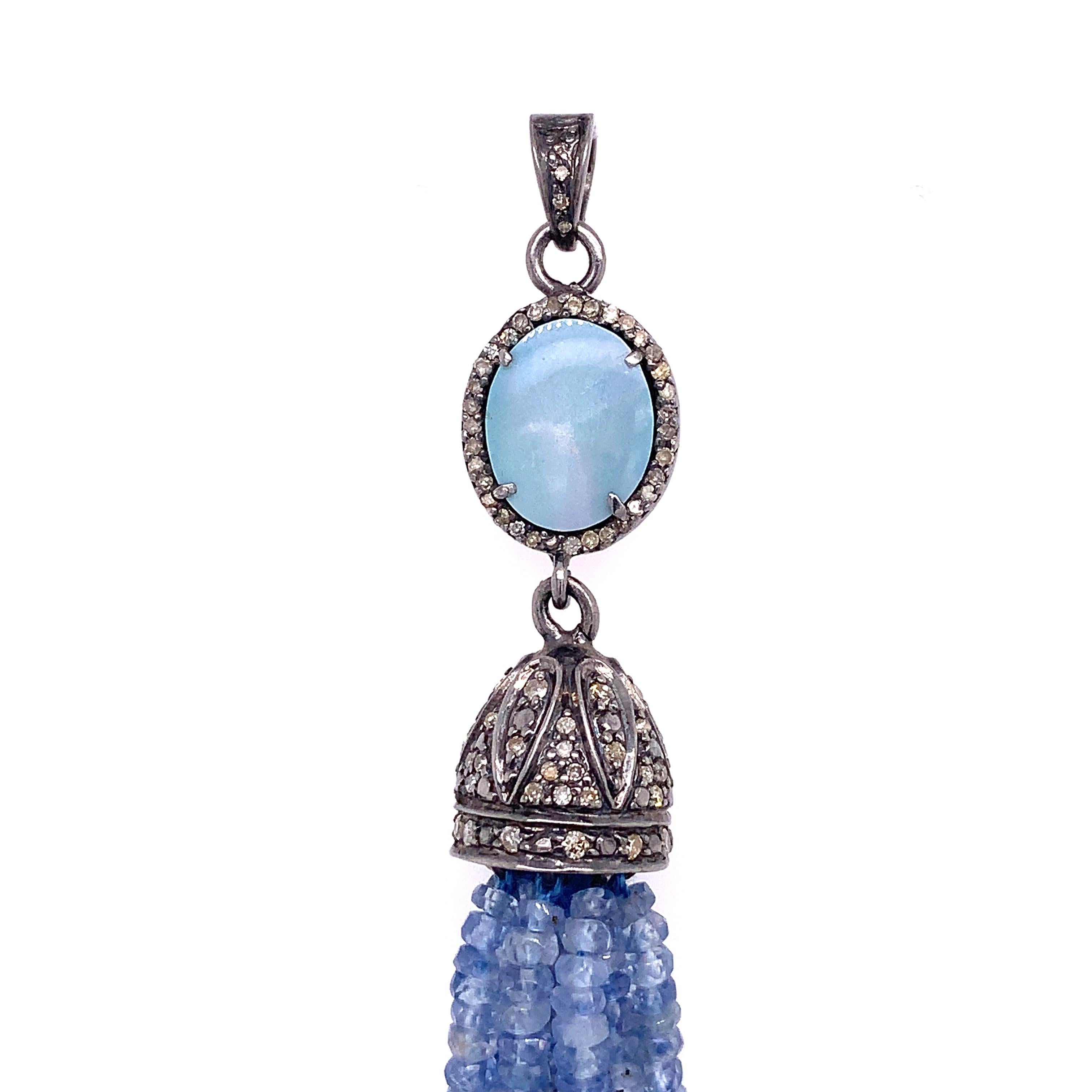 Life in color collection

Opal Slice & Tanzanite Tassel are set in Sterling Silver.

Tanzanite : 48.58ct total weight.
Opal : 3.51ct total weight.
Diamond : 0.54ct total weight.