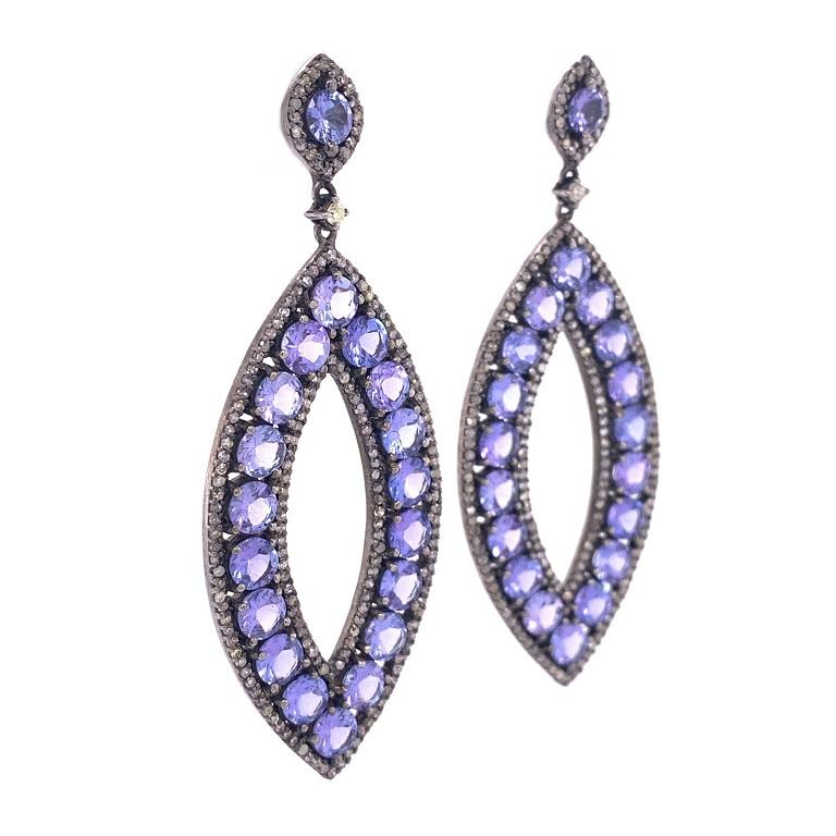 Jasmine Collection

Marquise shape drop earrings featuring Tanzanite and rustic Diamonds set in darkened sterling silver.

Tanzanite: 12.31ct total weight.
Diamonds: 1.78ct total weight 