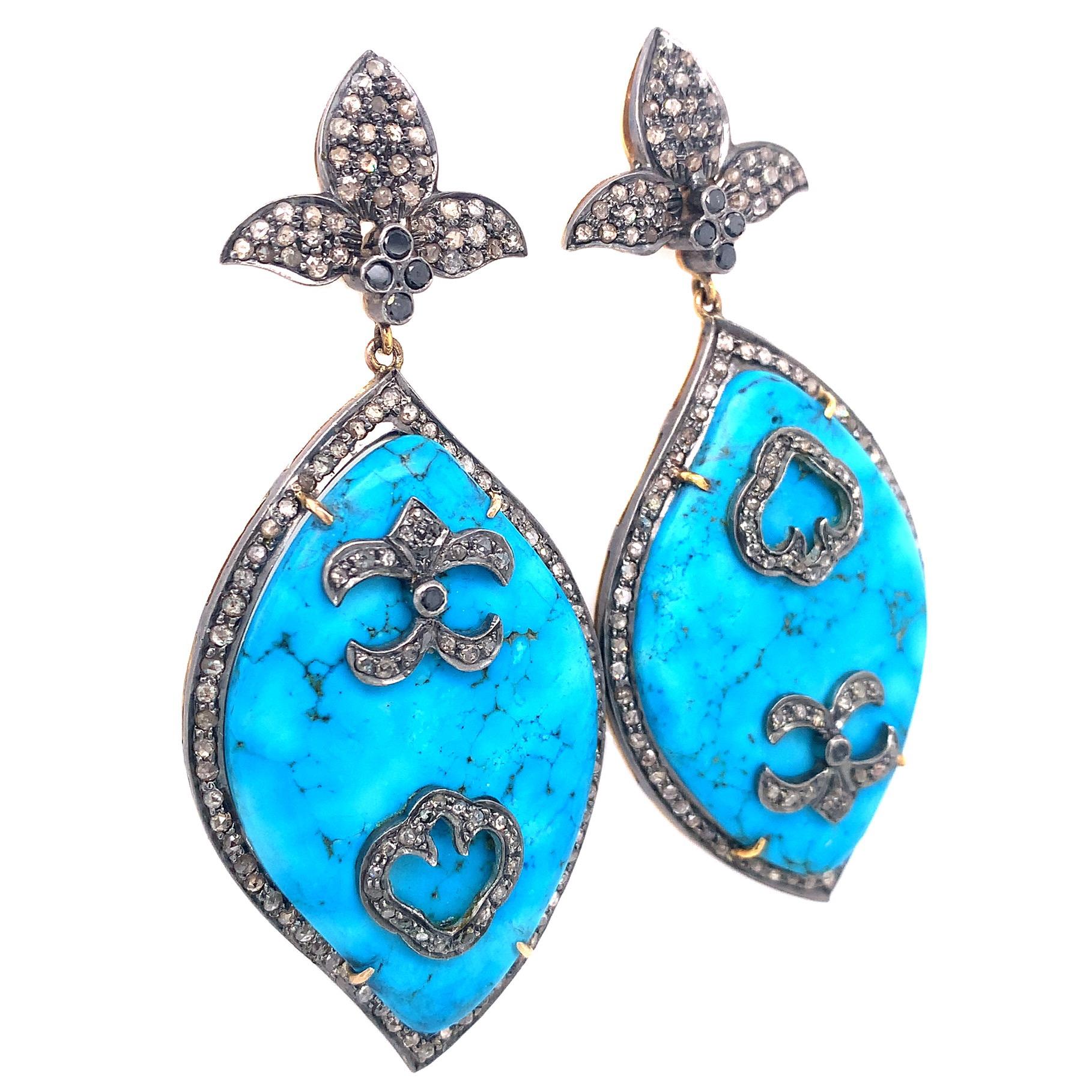 Life in color Collection

Natural Slice Turquoise with icy Diamonds statement earring set in Silver and 14 K gold plated.

Turquoise:  54.93 ct total weight.
Diamond: 4.31 ct total weight.
