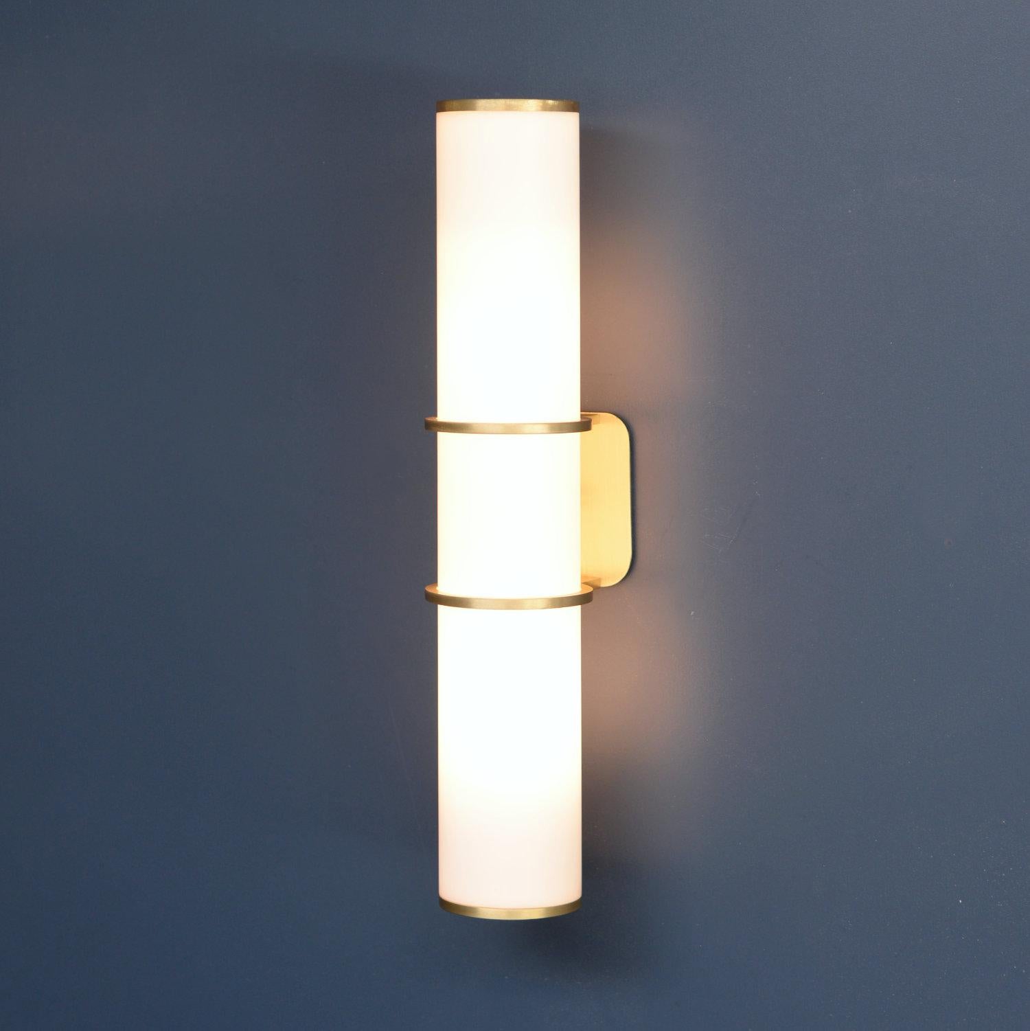 With its towering presence, the LUCERNA wall light is a true statement. The lightly aged & brushed brass collars & caps add a touch of luxury to the clean lines & minimal form.

Equally at home in hallways, living rooms & bedsides and also ideal
