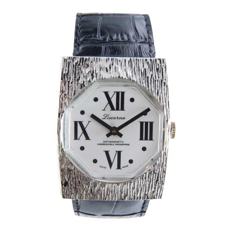 FACTORY / HOUSE: Lucerne Watch Company
STYLE / REFERENCE: Art Deco Oversized 
METAL / MATERIAL: Nickel
CIRCA / YEAR: 1970's
DIMENSIONS / SIZE: Length 44mm x Width 35mm
MOVEMENT / CALIBER: Manual Winding 
DIAL / HANDS: Original White with Roman