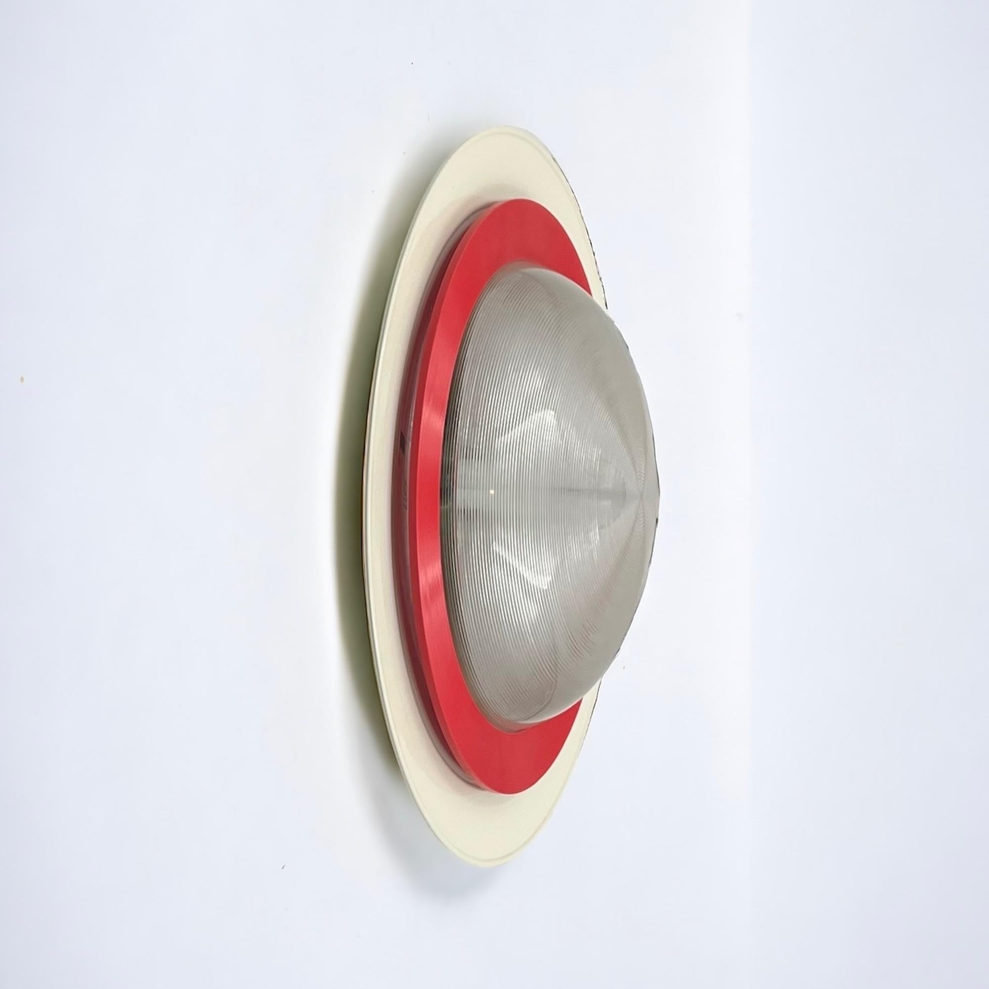 Dive into the nostalgia of the 1980s with the rare ‘Sat 50’ flush mount lamp by Luci Milano, a true gem of vintage design. This impressive 80s design lamp, a maxi version of the iconic creation by Gigante Boccato and Zambusi, boasts a large white