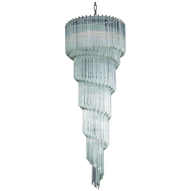 Italian spiral chandelier shown in clear Murano glasses cut into four points using Quadriedri technique, mounted on chrome finish frame by Fabio Ltd / Made in Italy
13 lights / E12 or E14 type / max 40W each
Height: 59 inches plus chain and canopy /