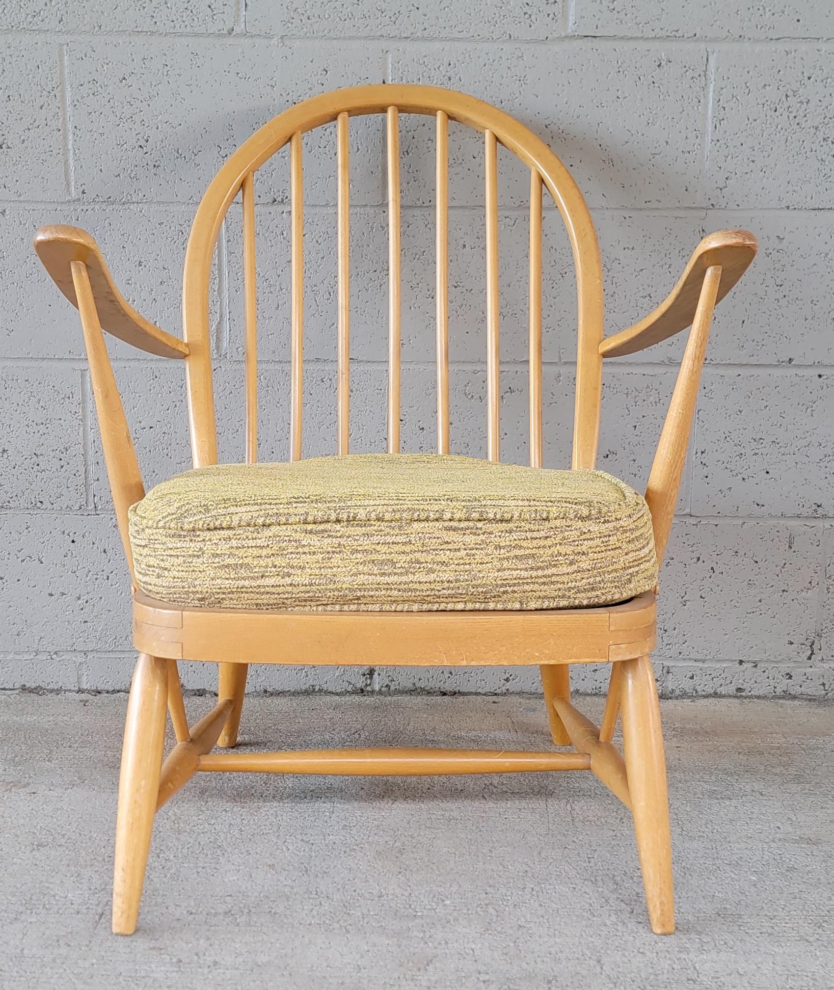 Hoop back beech wood armchair designed by Lucian Ercolani for Ercol. England circa. 1960. Retains Ercol label. Original finish and condition with wear and patina. Structurally solid. Original fabric could be saved, but needs new foam.