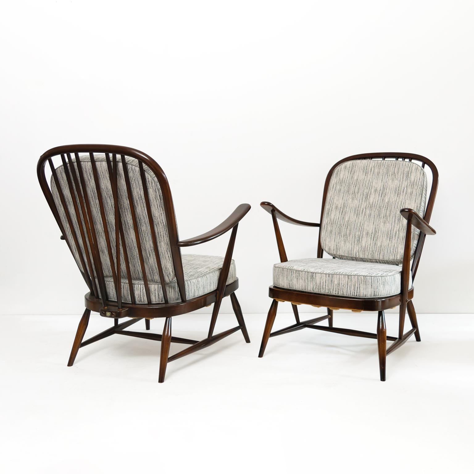 A pair of Lucian Randolph Ercolani designed “Windsor” chairs for his company Ercol, England, circa 1950’s. Italian born Ercolani moved to the UK where he opened his own furniture company. His midcentury modern take of the classic English Windsor